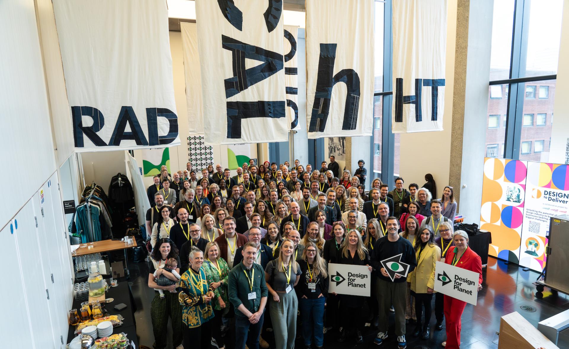 Gathering of creative professionals at the Design for Planet Festival, showcasing collaboration and innovative design solutions for sustainability.