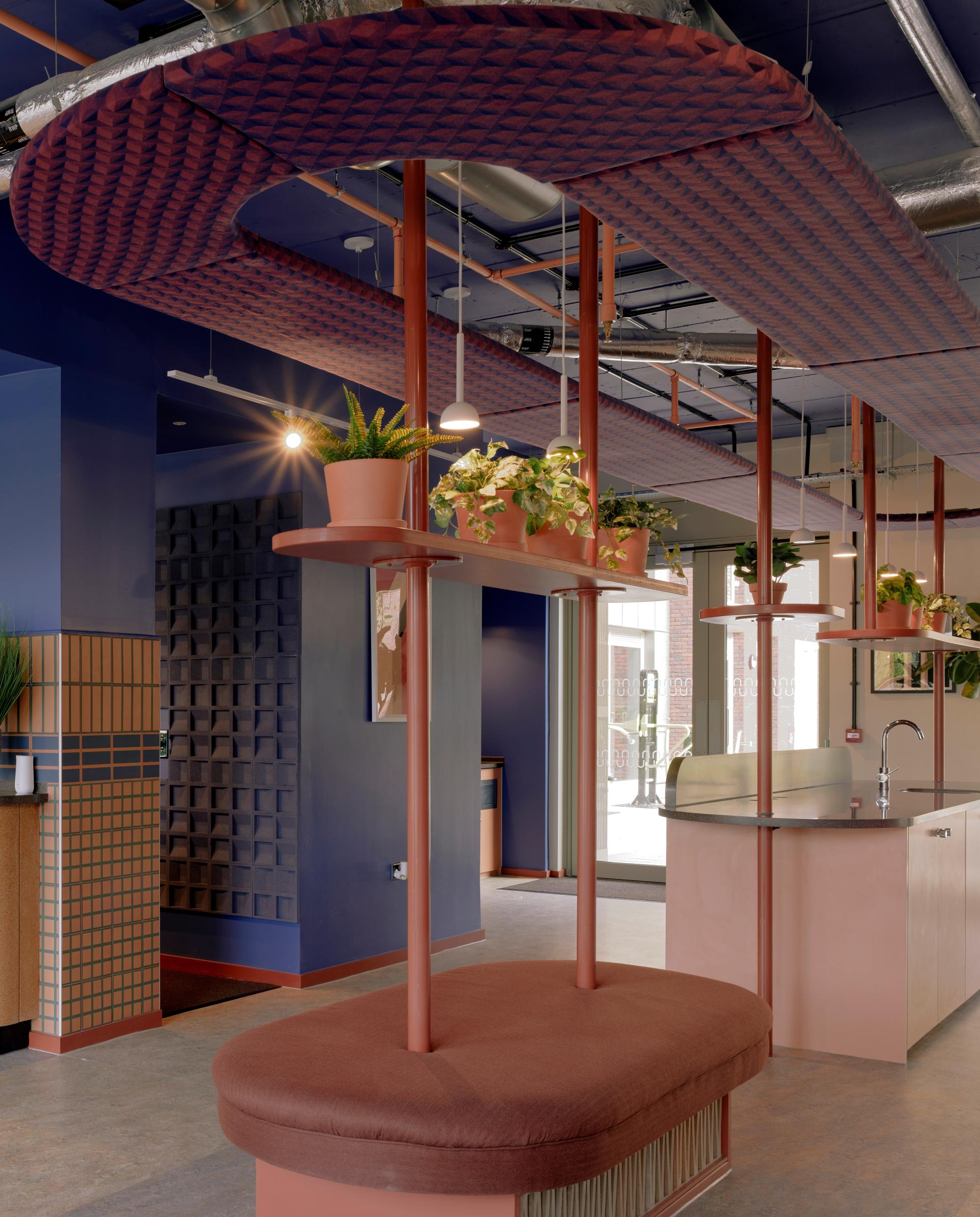 Modern interior design of Enso, a new student accommodation in Colchester, featuring vibrant colors and greenery.