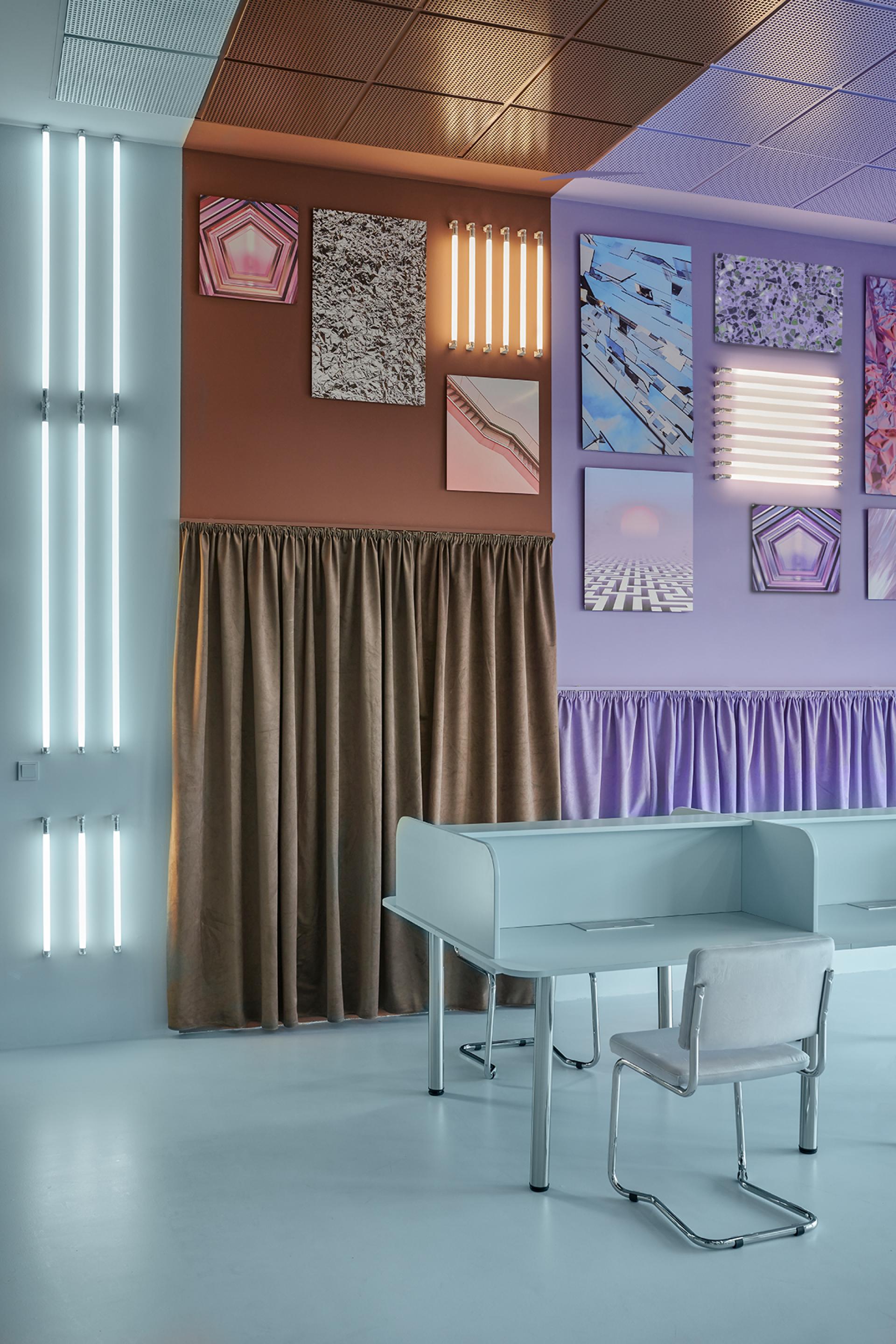 Modern coworking space in Valencia featuring artistic decor, creative workstations, vibrant colors, and stylish lighting design.