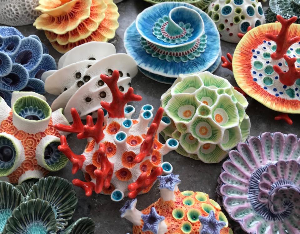 Colourful clay sculptures of coral reefs and sea life, showcasing intricate designs by Aardman Animations sculptor Lisa Stevens.