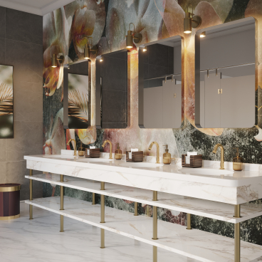 Elegant bathroom design featuring Crosswater's new sensor taps, marble sink, and artistic wall decoration.