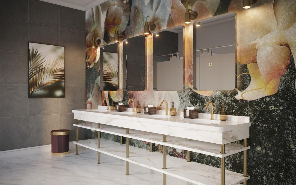Elegant bathroom design featuring Crosswater's new sensor taps, marble sink, and artistic wall decoration.