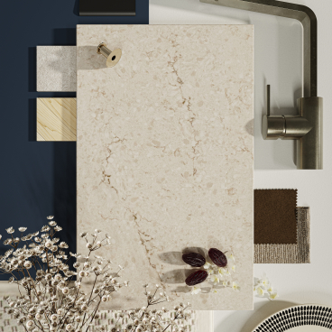 Taj Royale surface with warm beige tones, dark brown veins, and white accents alongside complementary materials and decor elements.