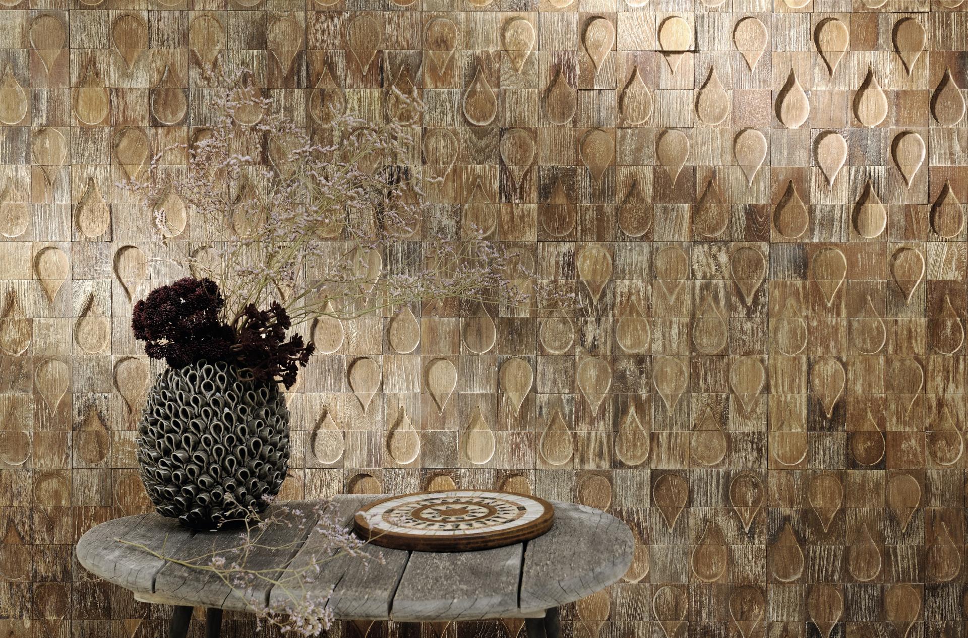 Stylish wooden wall art with an elegant vase and decorative tabletop, showcasing contemporary design at Paris Design Week.