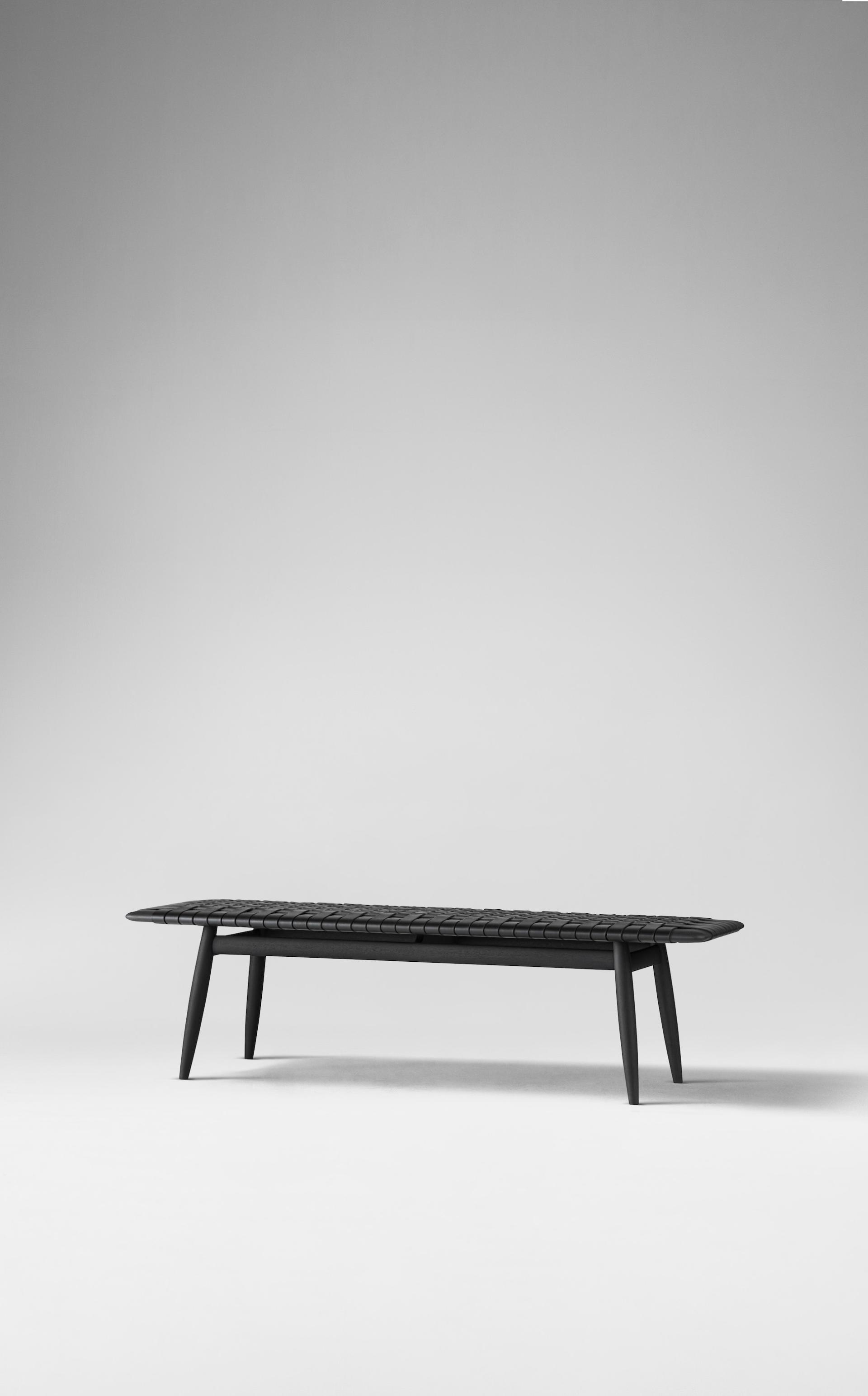 Modern minimalist black bench featuring Japanese design elements, ideal for stylish interiors and serene spaces.