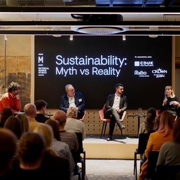 Panel discussion on sustainability held by Material Source Studio, featuring speakers engaging with an audience about myths and realities.