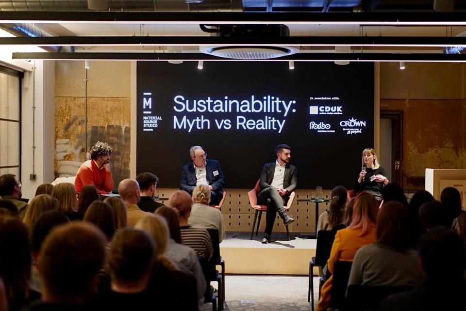 Panel discussion on sustainability held by Material Source Studio, featuring speakers engaging with an audience about myths and realities.