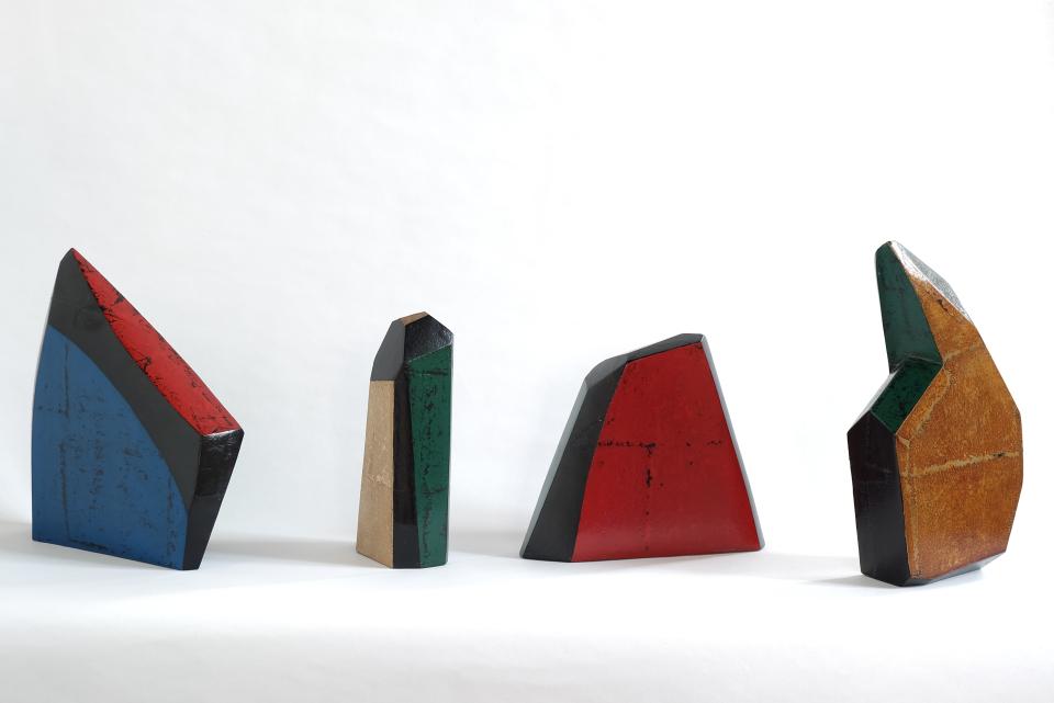 Colorful modern sculptures in geometric shapes displayed at the Collect art fair, showcasing contemporary craft and design.