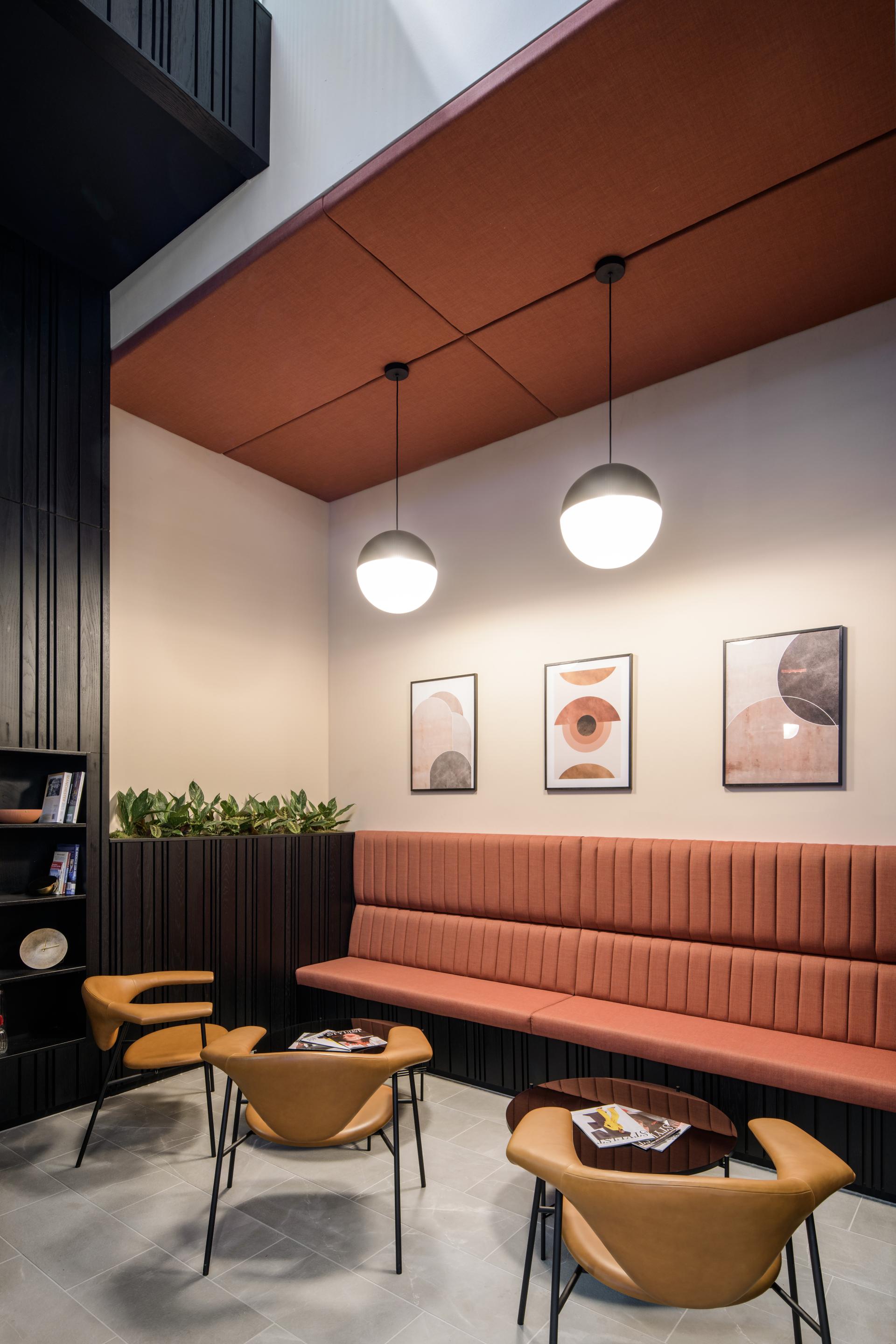 Modern seating area in One Piccadilly Gardens showcasing stylish design by SpaceInvader with artwork and plants.