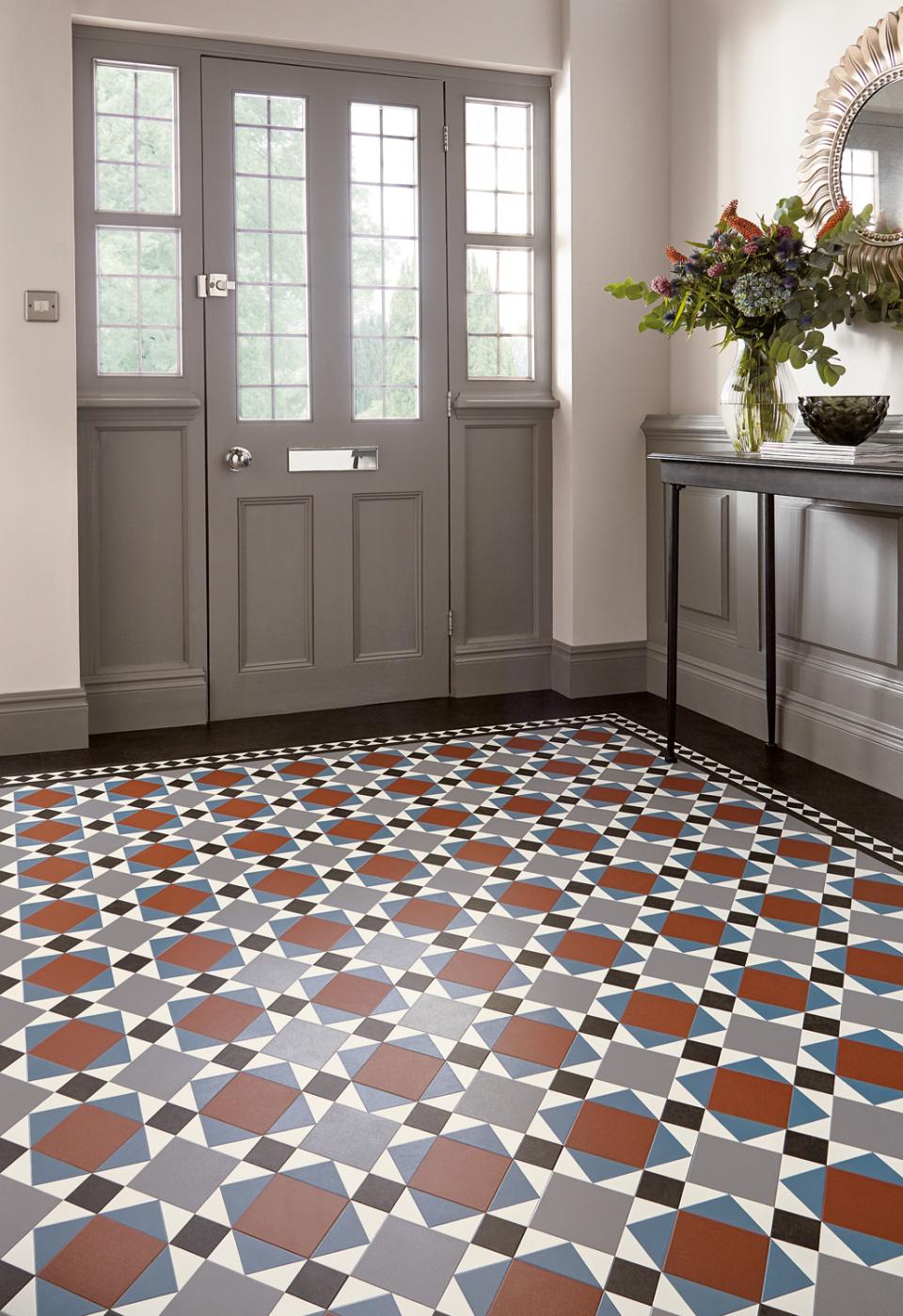 Heritage tile flooring featuring a Victorian and Regency pattern, enhancing a stylish interior entryway.