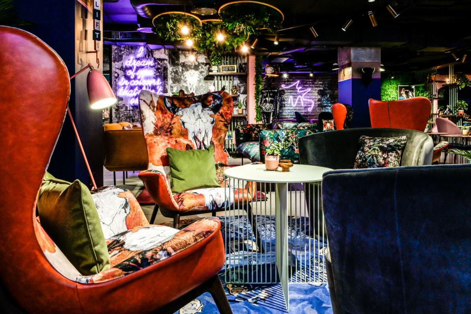 Vibrant interior featuring bold, artistic furniture and decor at Manchester's Qbic hotel by BOBO1325.