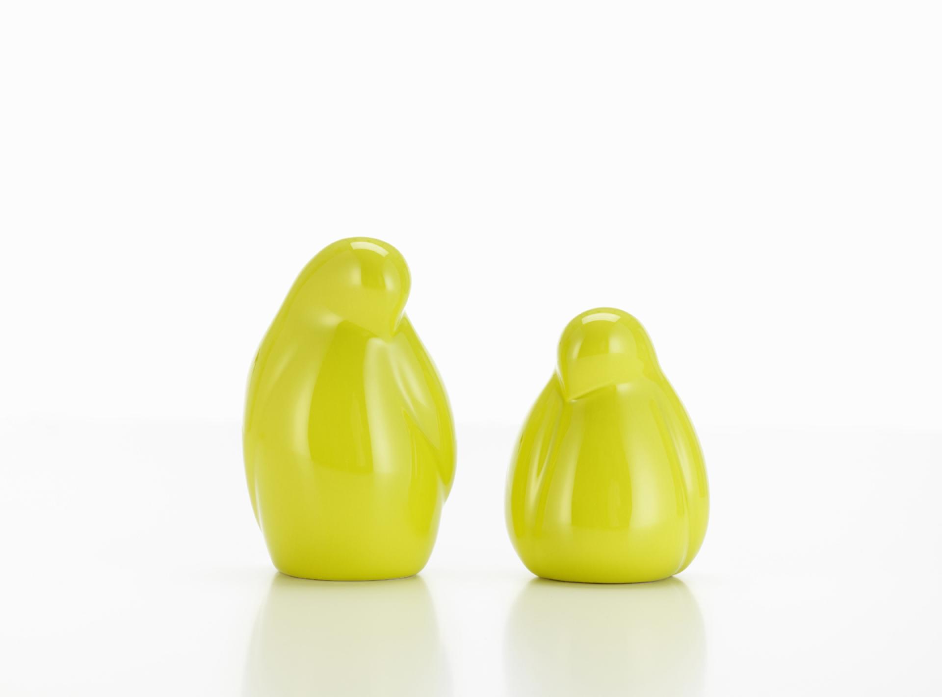 Bright yellow decorative figures designed by Alexander Girard, showcasing modern design aesthetics in Vitra's Accessories Collection.