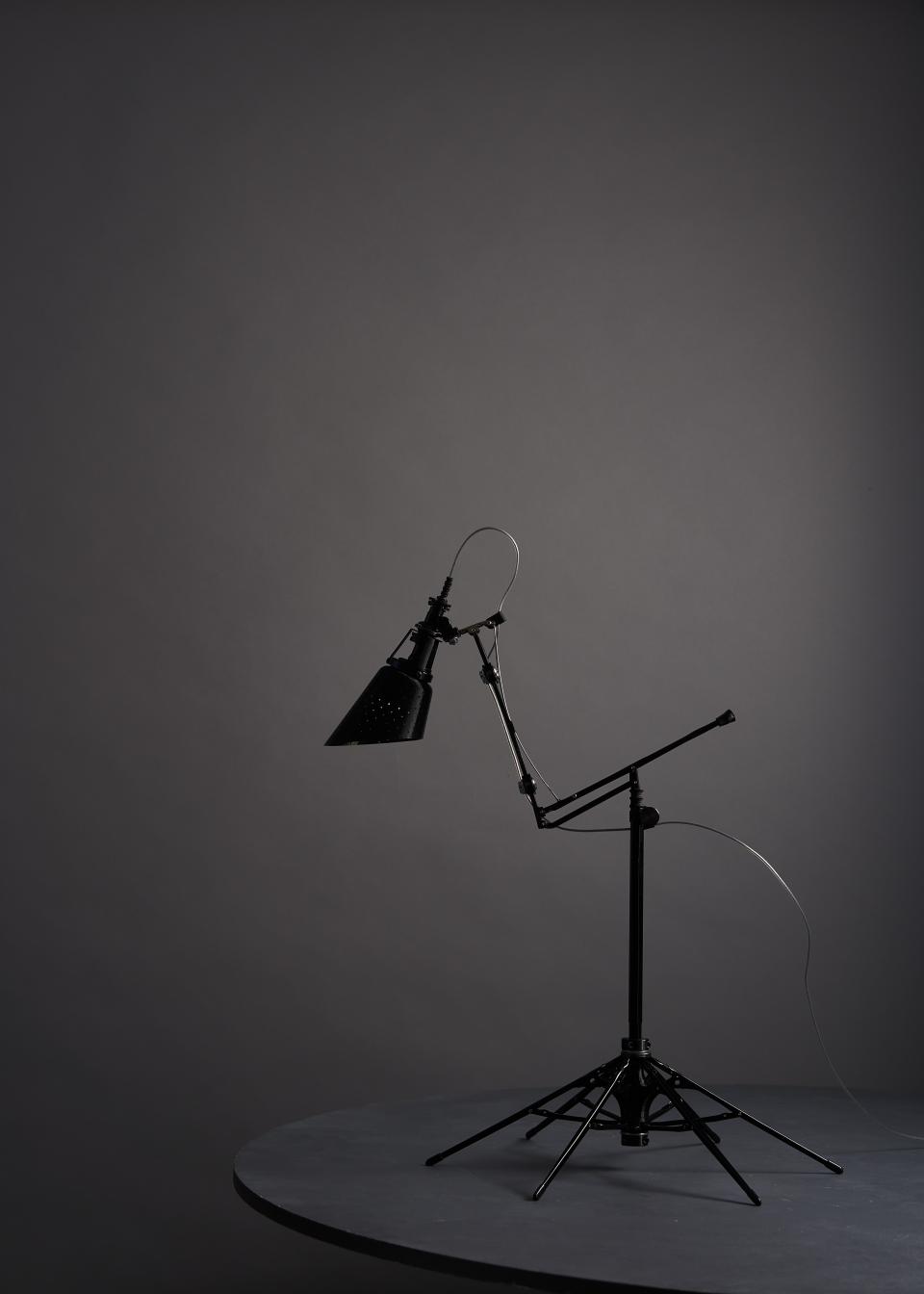 Upcycled lamp made from a repurposed umbrella, showcasing innovative design and sustainability in home decor.
