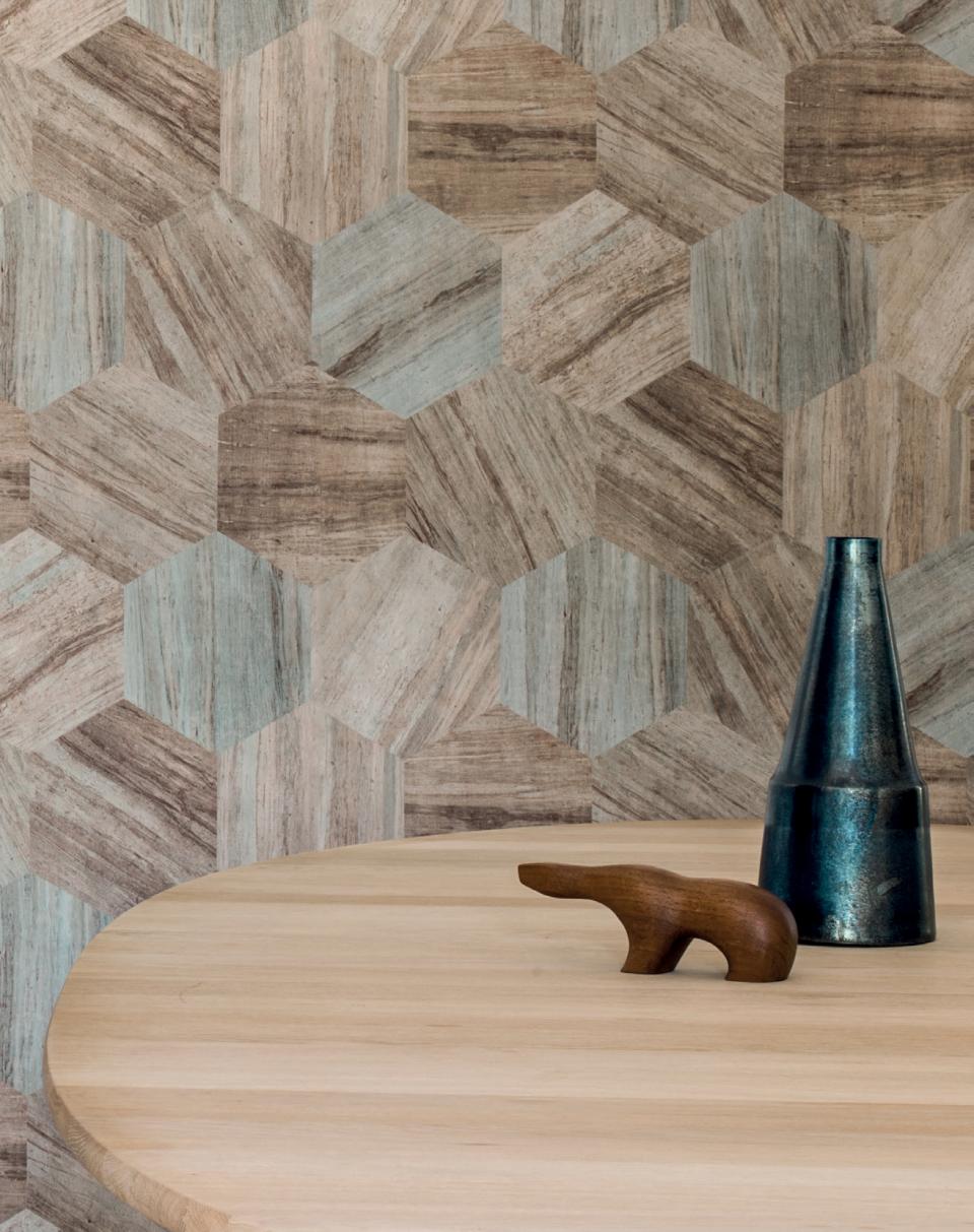Stylish interior featuring Tektura Wallcoverings’ hexagonal patterns, showcasing wooden decor and a contemporary tabletop design.