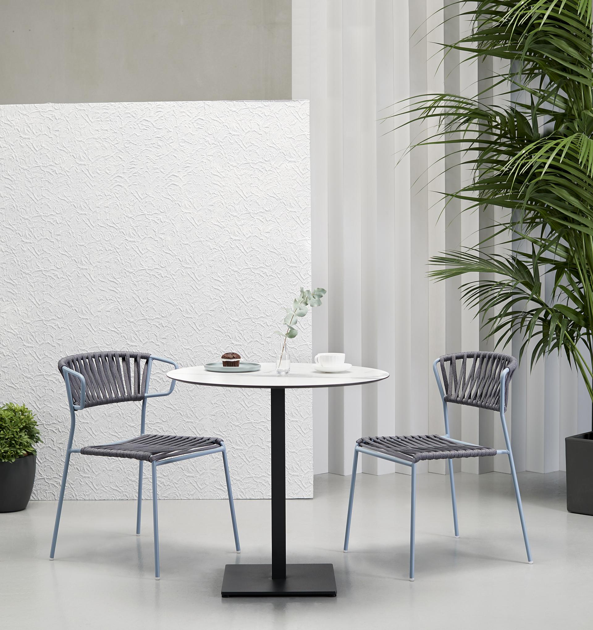 Stylish Lisa chairs by SCAB Design set around a modern table in an elegant indoor space, highlighting their award-winning design.