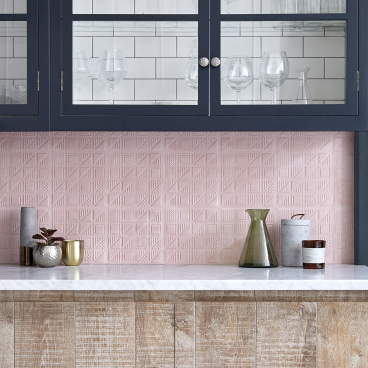 Elegant kitchen featuring the new Bermondsey patterned tiles by Lindsey Lang, alongside decorative glassware and modern decor.