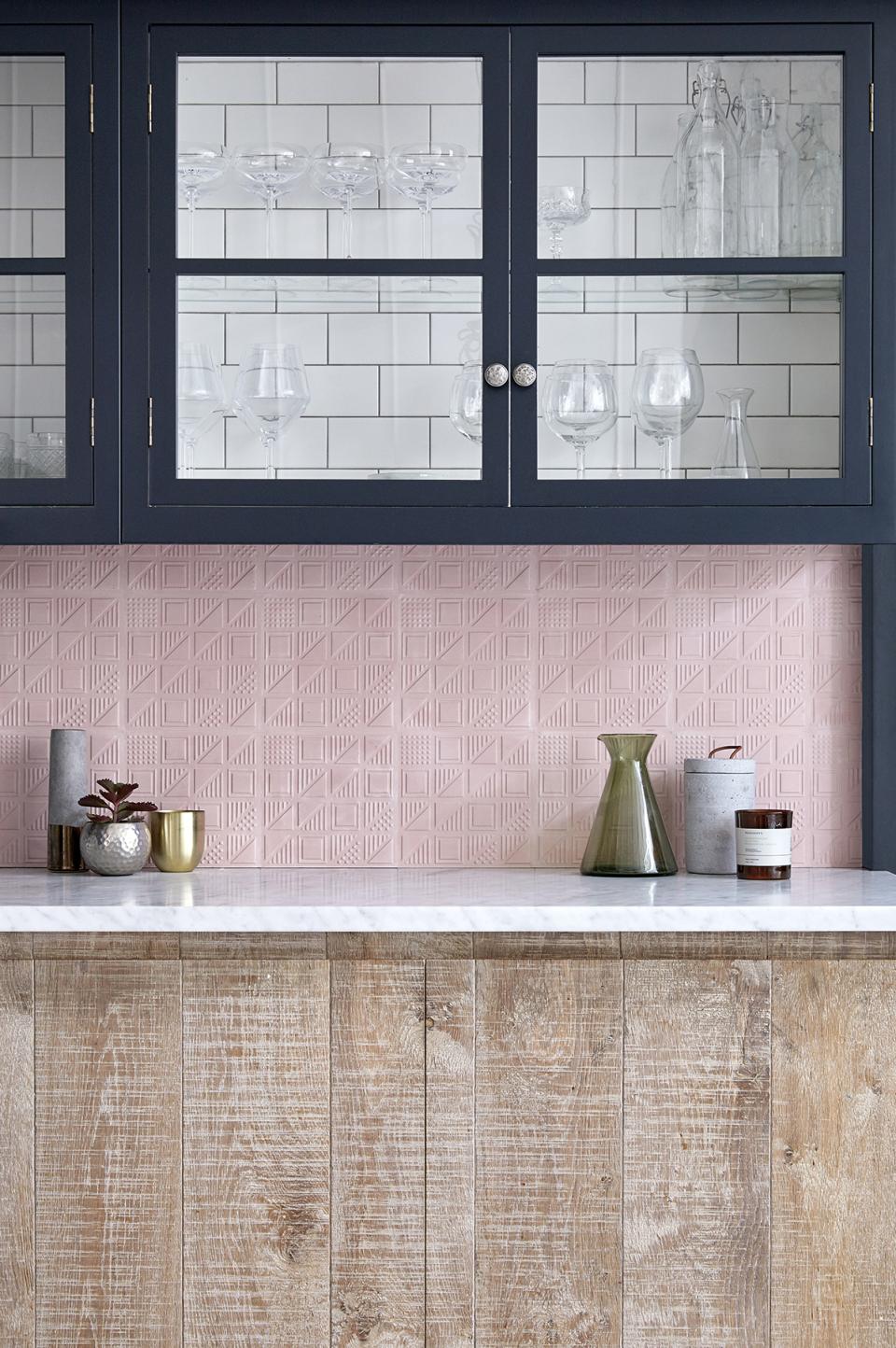 Elegant kitchen featuring the new Bermondsey patterned tiles by Lindsey Lang, alongside decorative glassware and modern decor.