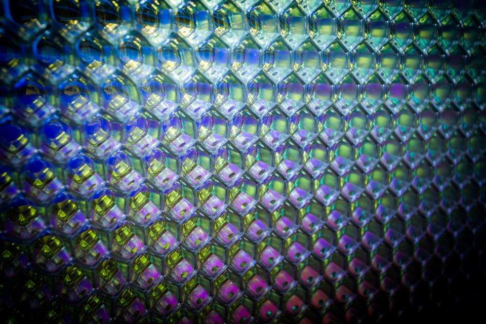 Close-up of decorative aluminium composite panels showcasing vibrant colors and geometric patterns, highlighting innovative surface design by Mykon.