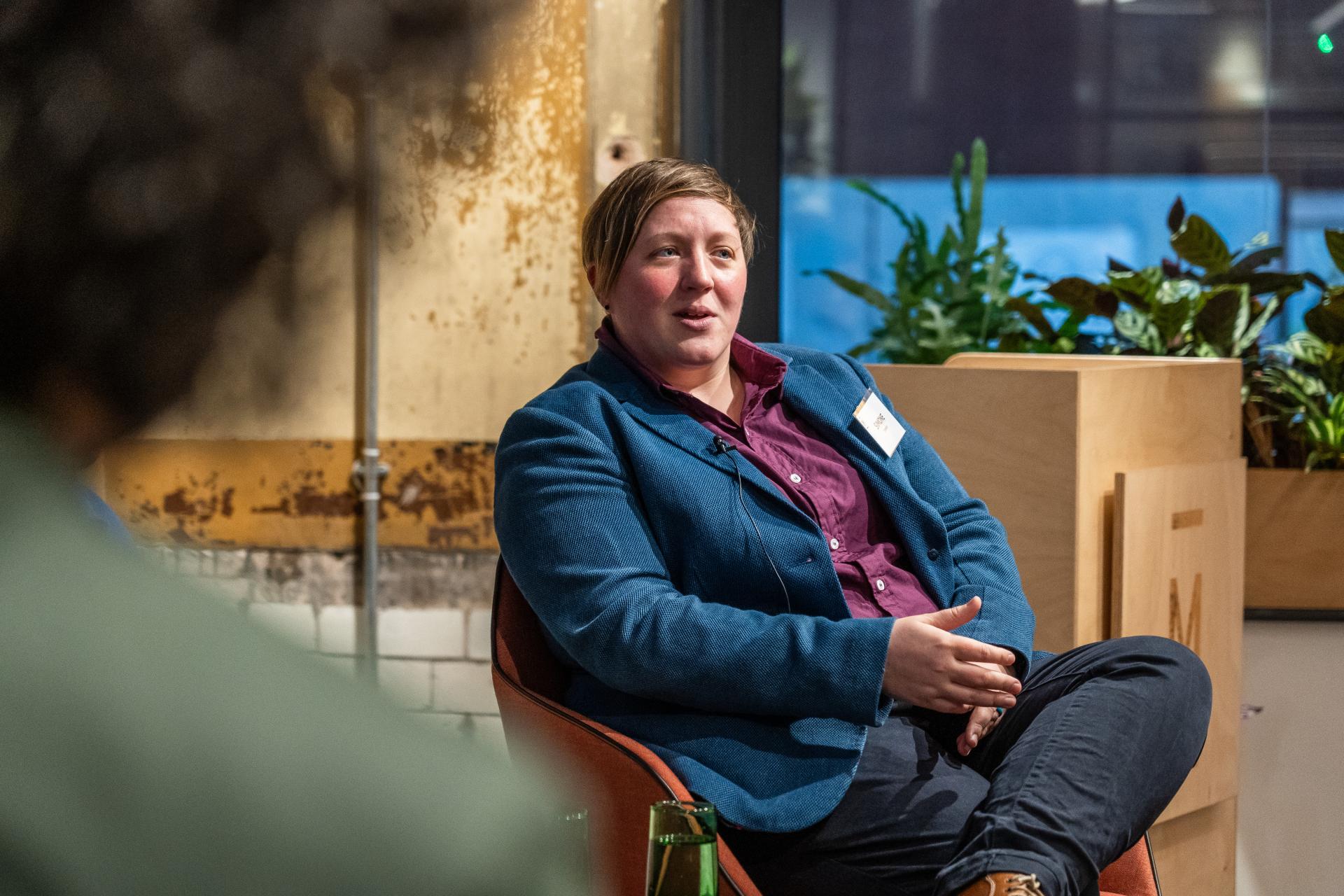 A participant engages in a discussion about modern workplaces, showcasing the evolving nature of work environments.