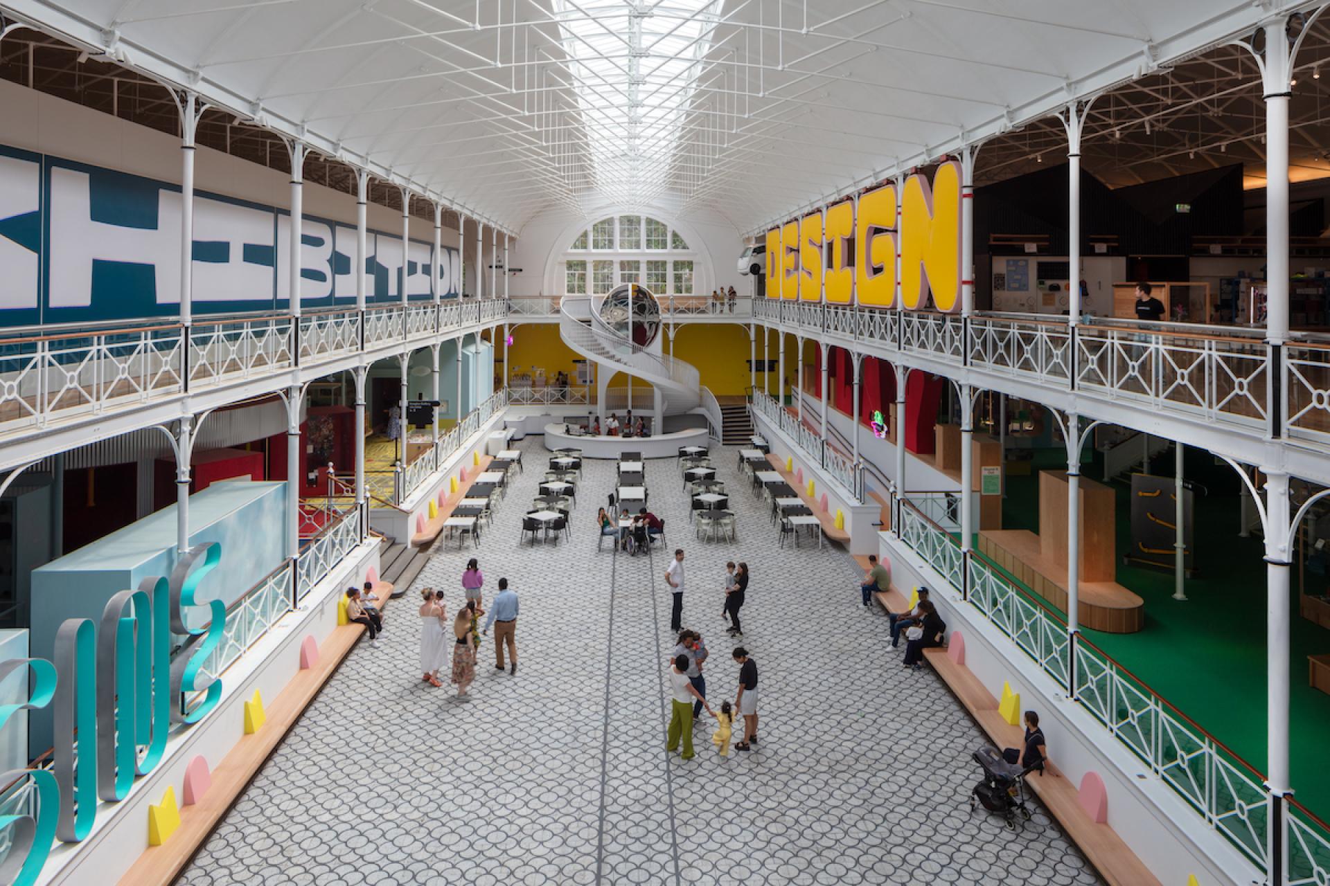 Vibrant interior of Young V&A, showcasing interactive spaces for children with seating areas and colorful design elements.