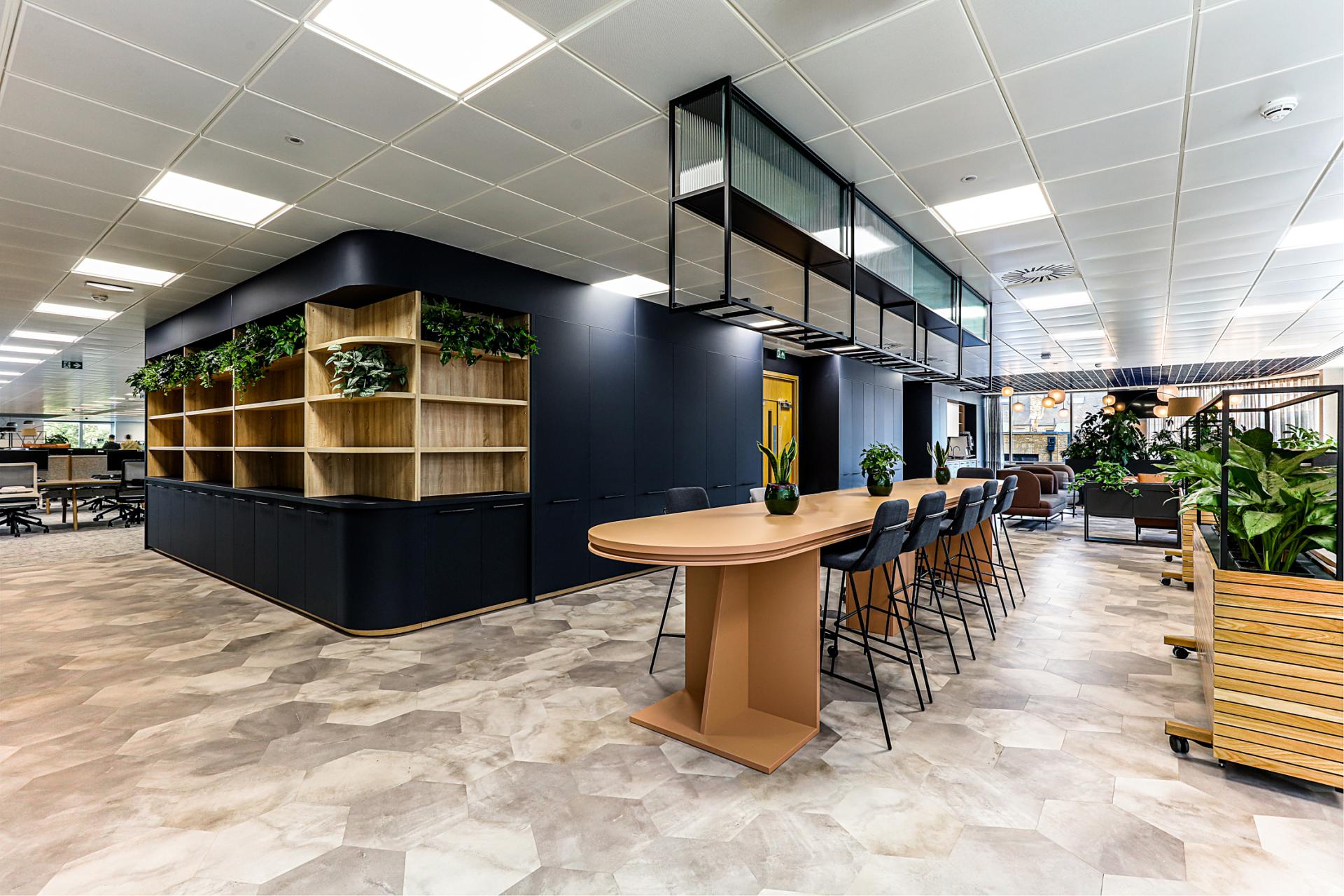 Modern office space at Domestic & General's Wimbledon HQ featuring stylish furnishings, plants, and collaborative areas.