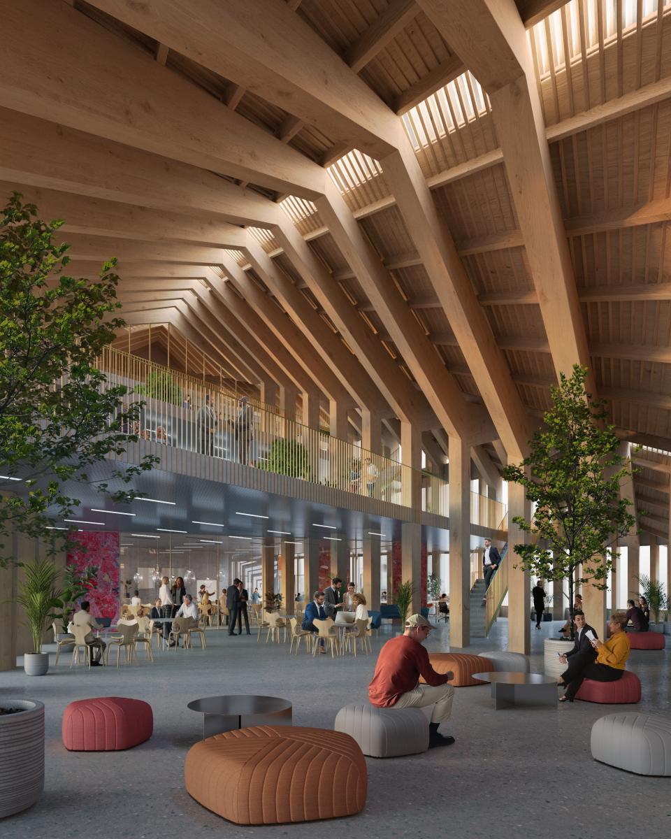 Interior view of Marengo Multimodal Transport Hub showcasing bio-based mass timber design, with vibrant seating and greenery.