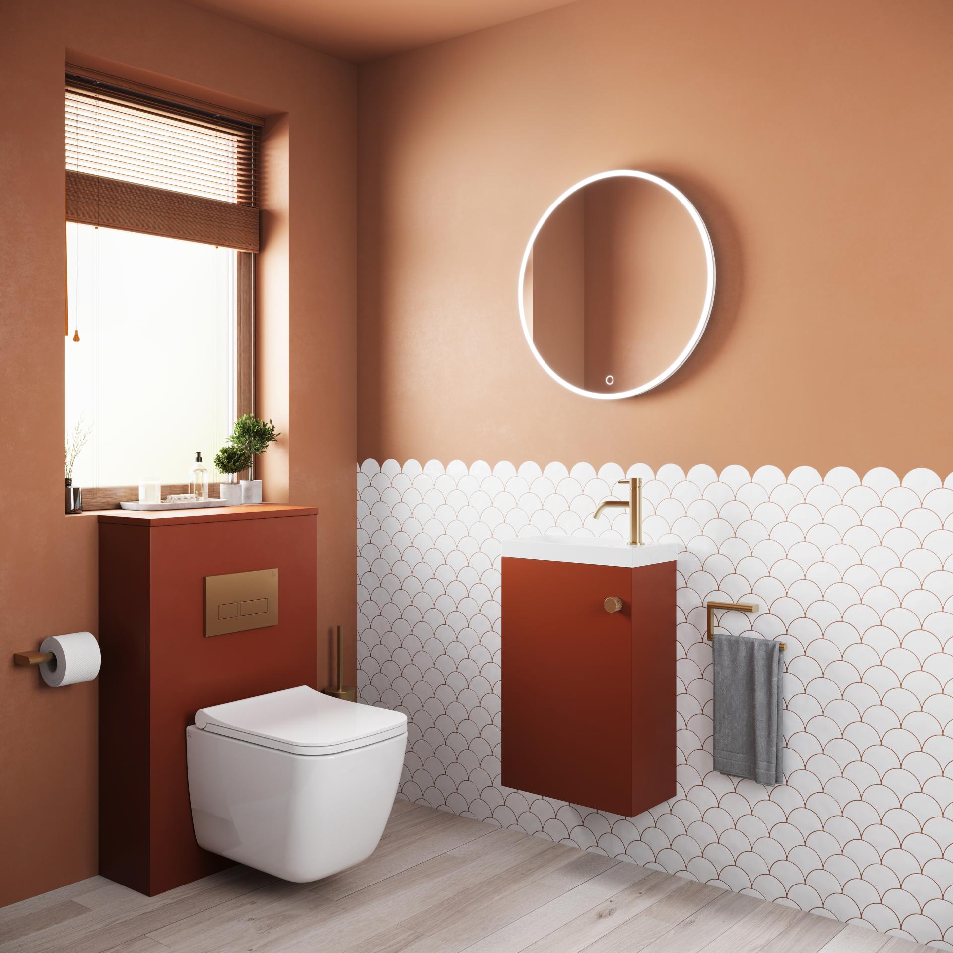 Stylish bathroom featuring terracotta walls, modern fixtures, and scalloped tile design, reflecting 2025 aesthetic trends.
