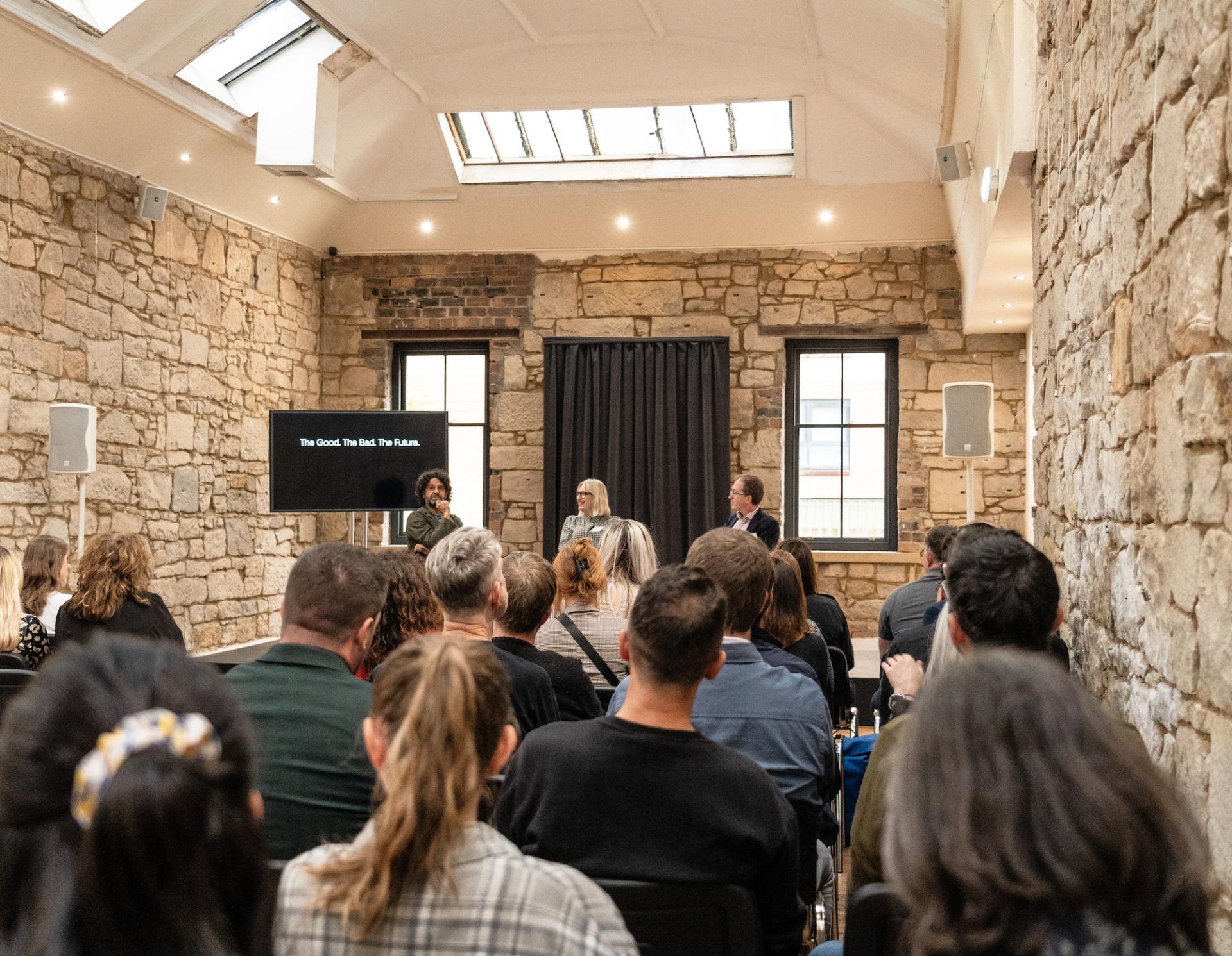 Seminar attendees listen to a discussion on Glasgow's property outlook, highlighting key issues and future prospects.