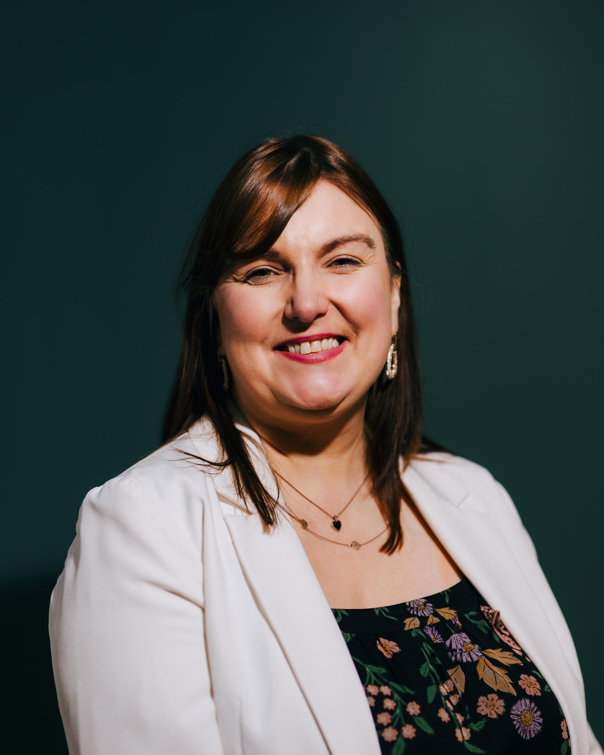 Director at Material Source Studio poses for a portrait, highlighting the importance of neurodiversity and flexibility in creative environments.