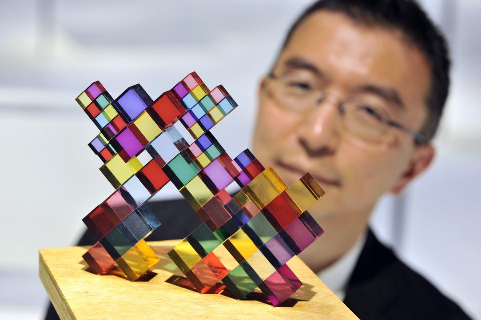 Colorful architectural model by Sou Fujimoto on a wooden base, showcased during his exhibit at Japan House London.
