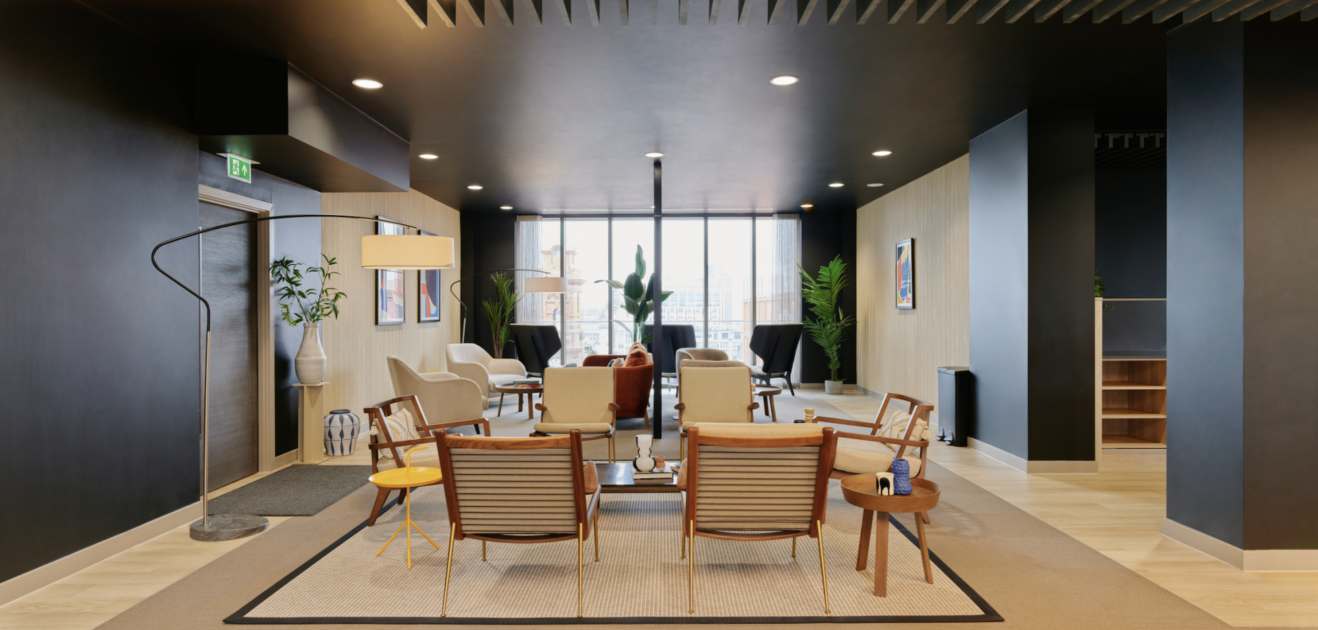 Modern communal lounge area featuring stylish seating and greenery, reflecting Vita Group's uhaus brand and BTR design ethos.