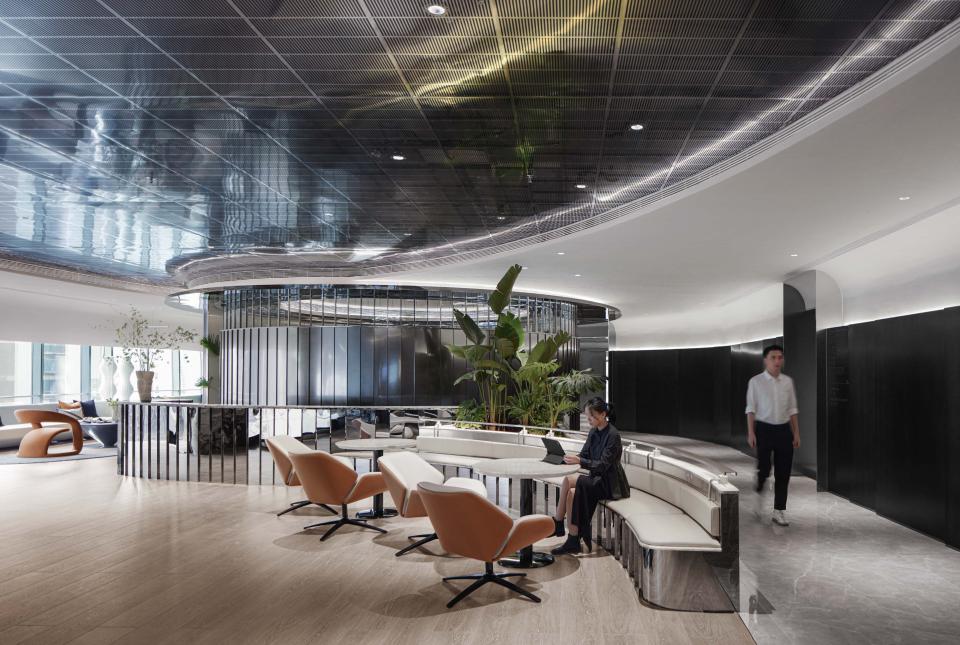 Modern interior design at Foshan Vanke Financial Centre featuring innovative seating, greenery, and a sleek ambiance.