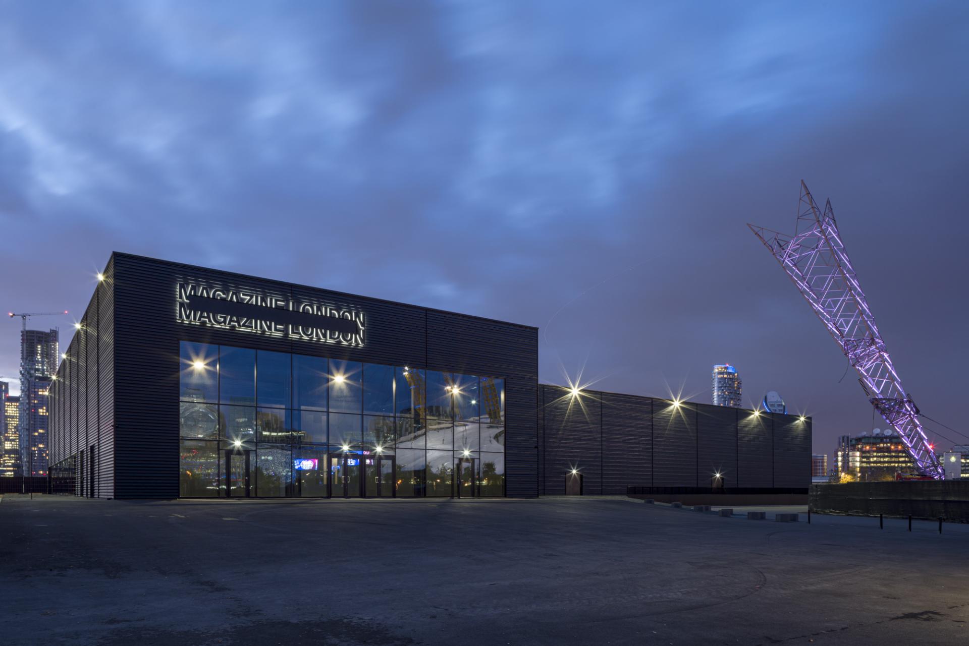 Modern architectural design of Magazine London illuminated at night, showcasing innovative theatre and event spaces in the city.