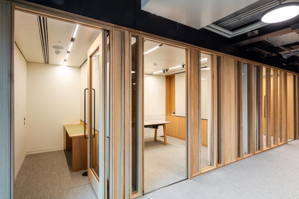 Bespoke timber framed glazed partitioning at Boston Consulting Group's London office, showcasing modern workspace design.