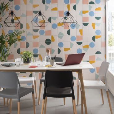 Contemporary dining area featuring Tom Pigeon's exclusive tile collection, surrounded by stylish chairs and modern lighting.