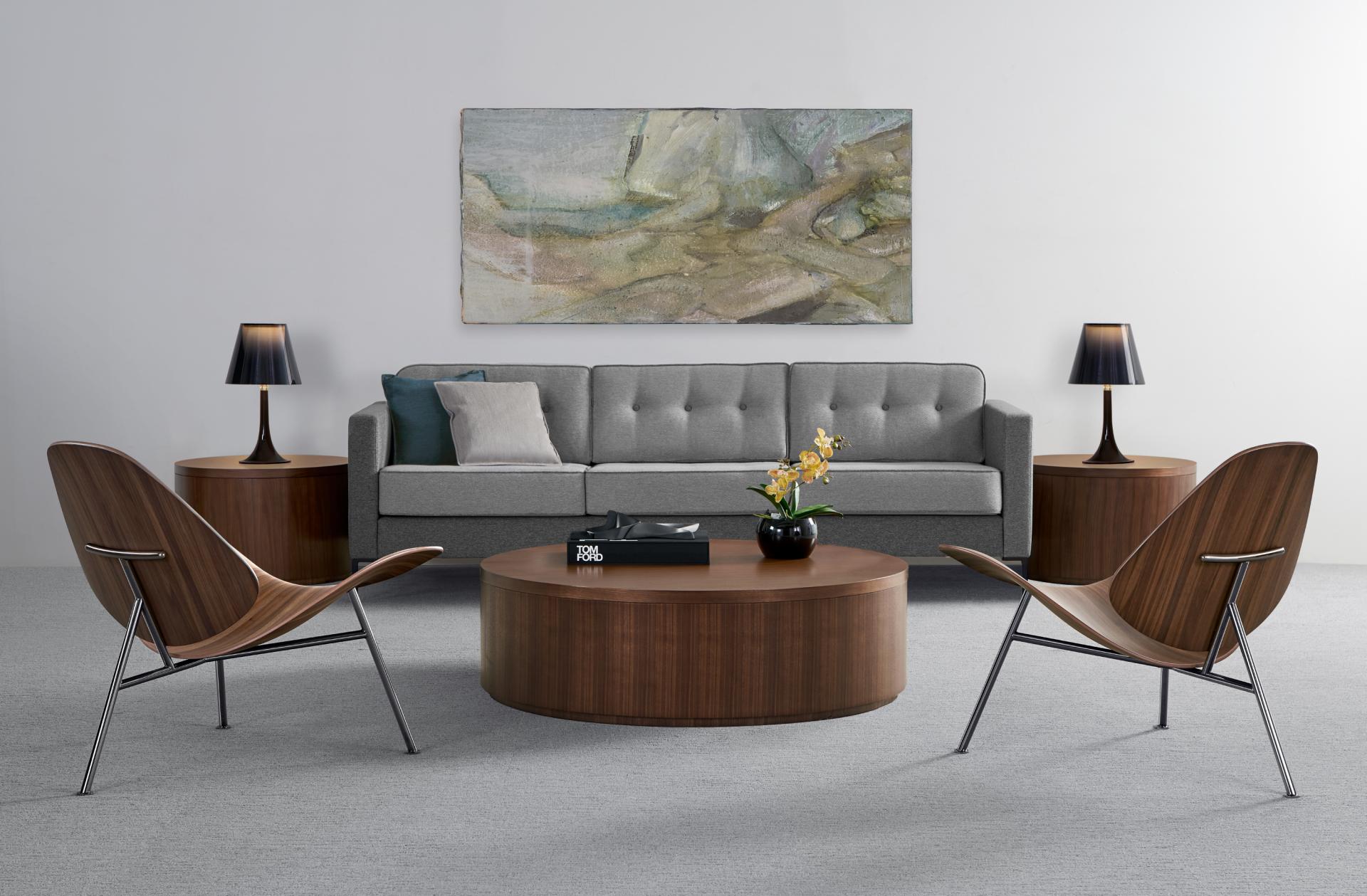 Stylish living room featuring the Pedersen lounge chair, a modern coffee table, and contemporary lighting for Bernhardt Design.