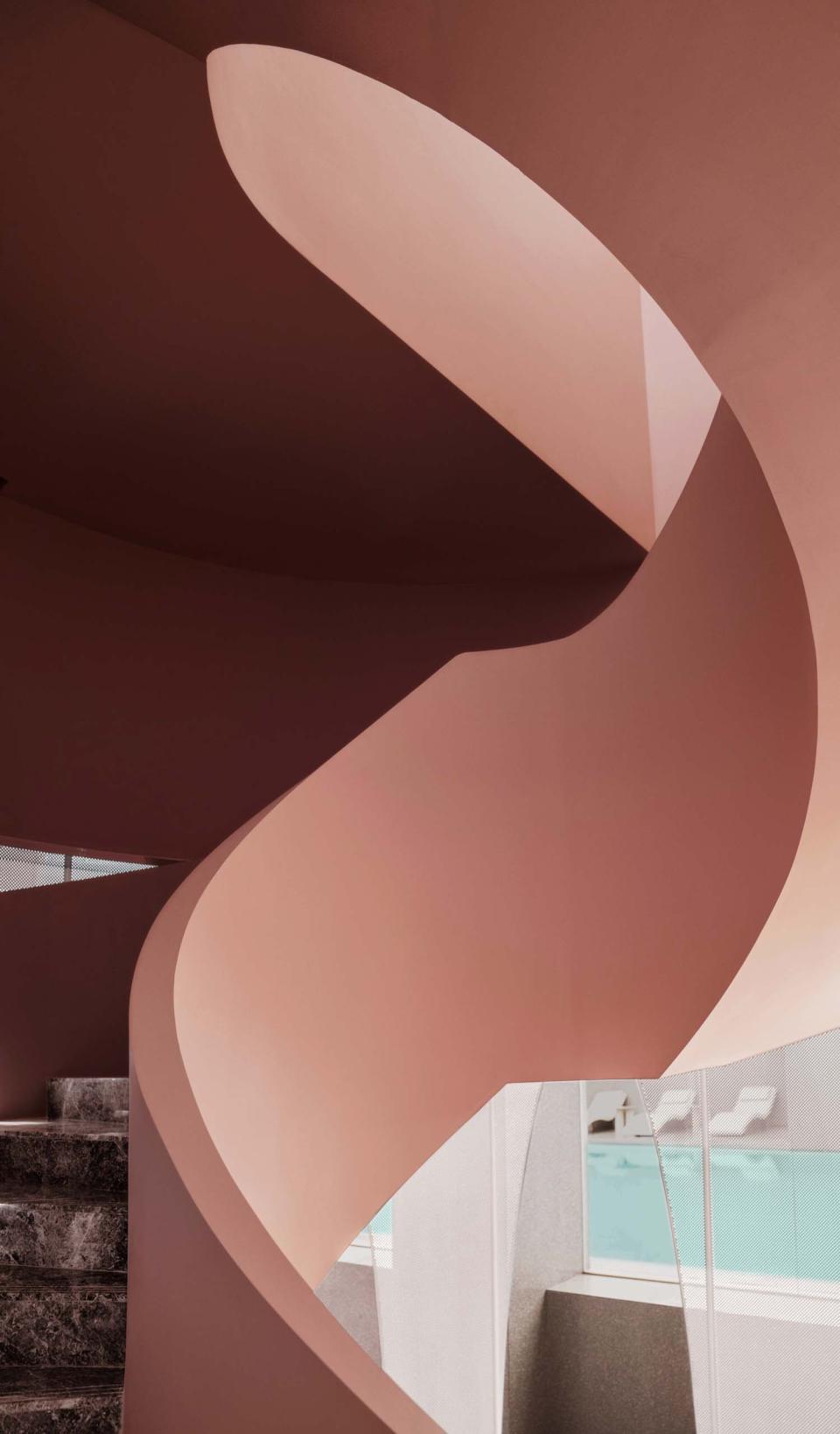 Curved interior architecture of the Rhythm community centre, showcasing innovative design and modern aesthetics in a floating urban environment.