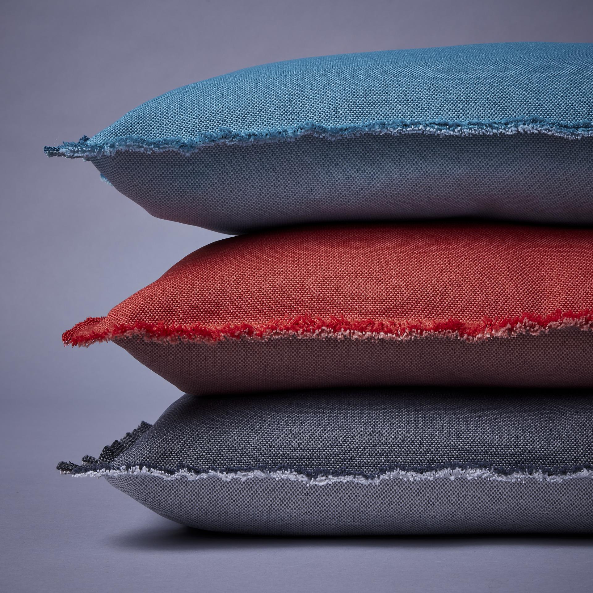 Eco-friendly pillows made from marine recycled materials, showcasing Camira's commitment to combating plastic pollution.