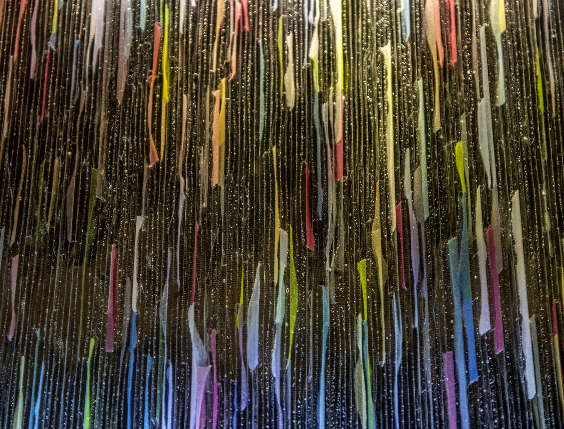 Colorful vertical stripes create a textured surface, showcasing innovative design elements featured at the Surface Design Show 2020.