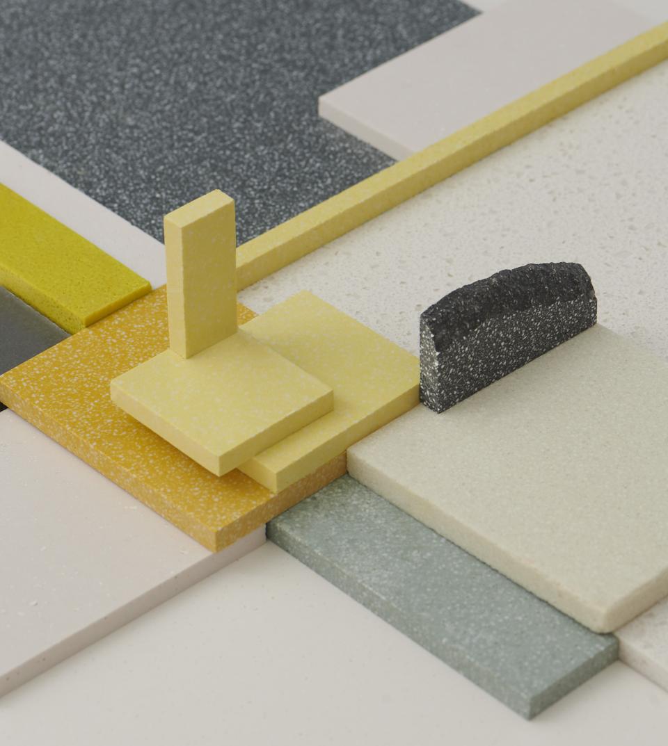 Colorful samples of Durat Plus surfaces made from recycled materials, showcasing innovative design and eco-friendly materials.