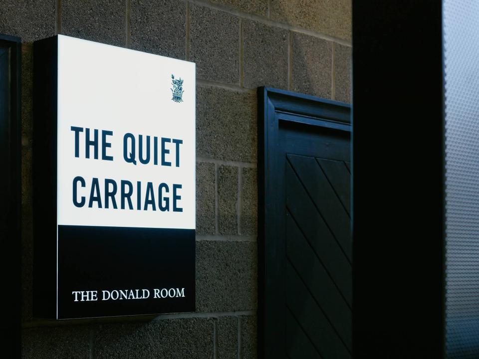 Signage for "The Quiet Carriage" in Sedbergh School's Donald Room, showcasing modern design and rich textures.