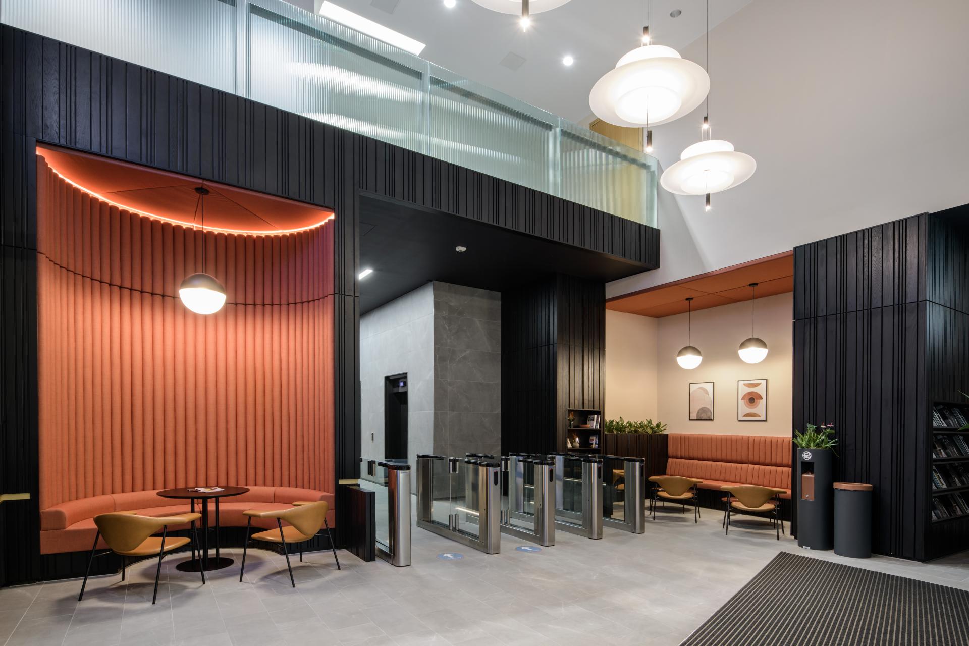 A modern reception area featuring stylish seating, unique lighting, and contemporary design elements by SpaceInvader in Manchester.
