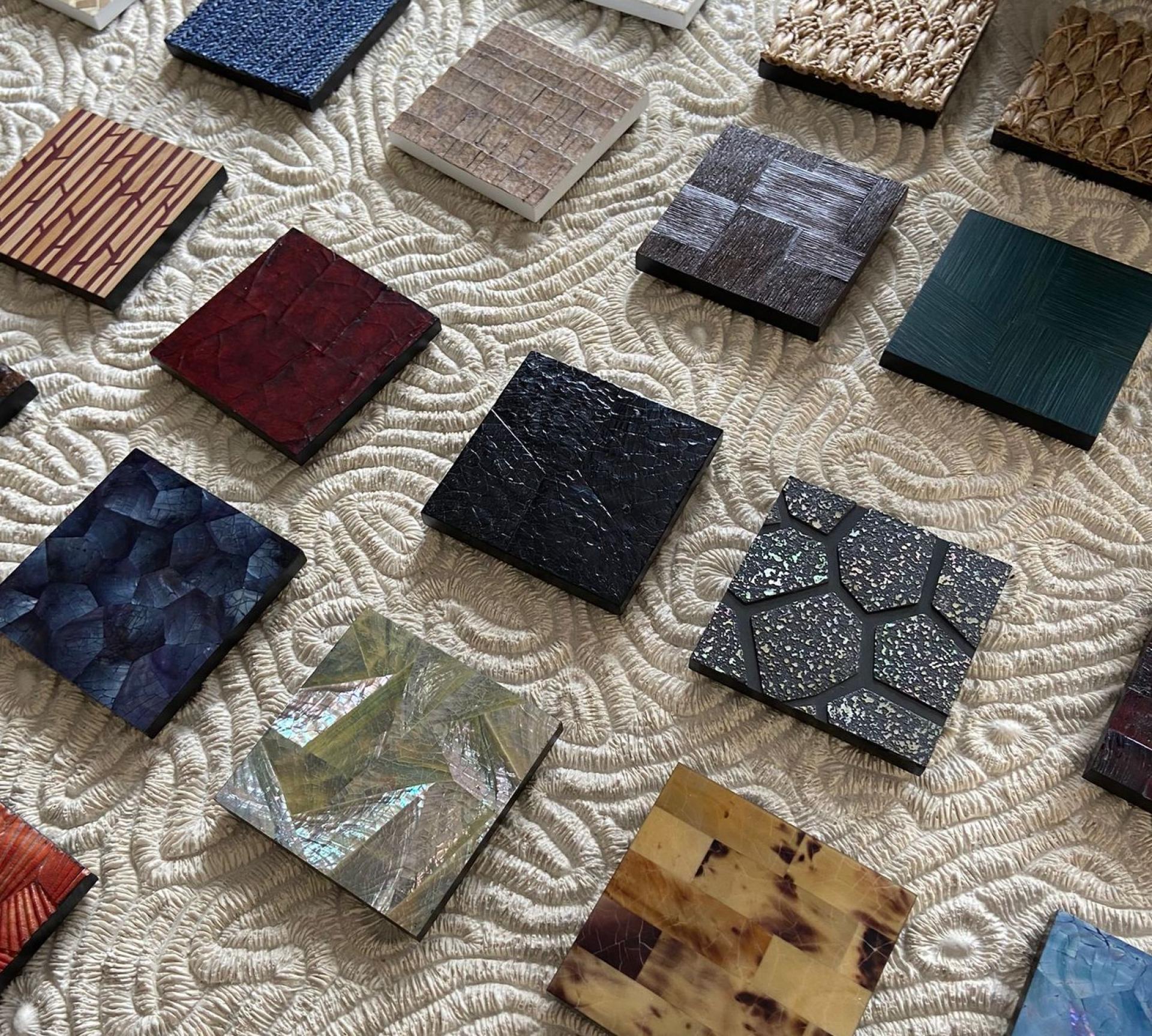 Diverse selection of sustainable biomaterial samples showcased on a textured surface, highlighting innovative design at LDF22.