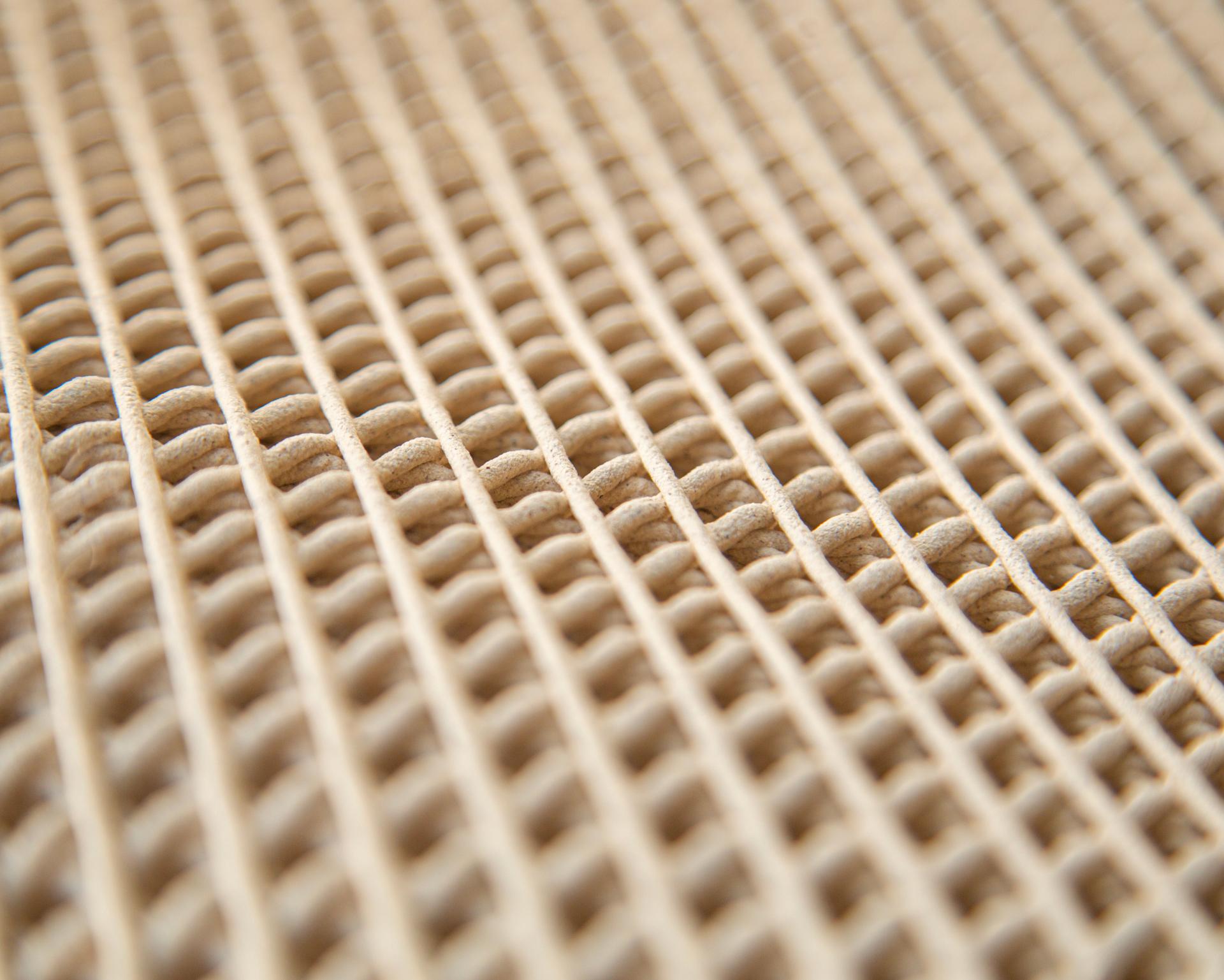 Woven surface of the WoodenWood Stool made from digitally fabricated sawdust, showcasing innovative sustainable design.