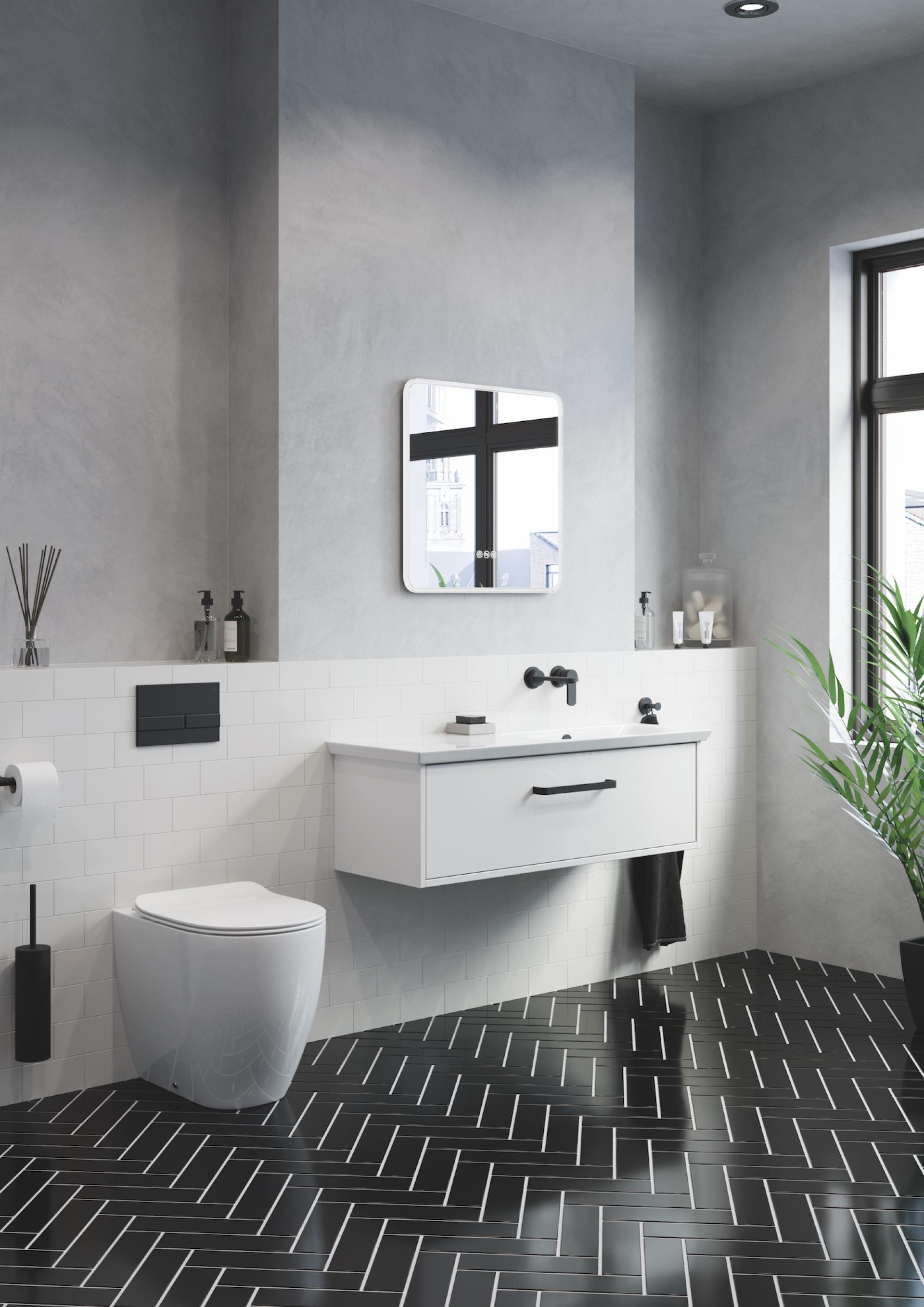 Modern bathroom interior featuring black herringbone floor tiles, sleek white cabinetry, and a minimalist design aesthetic.