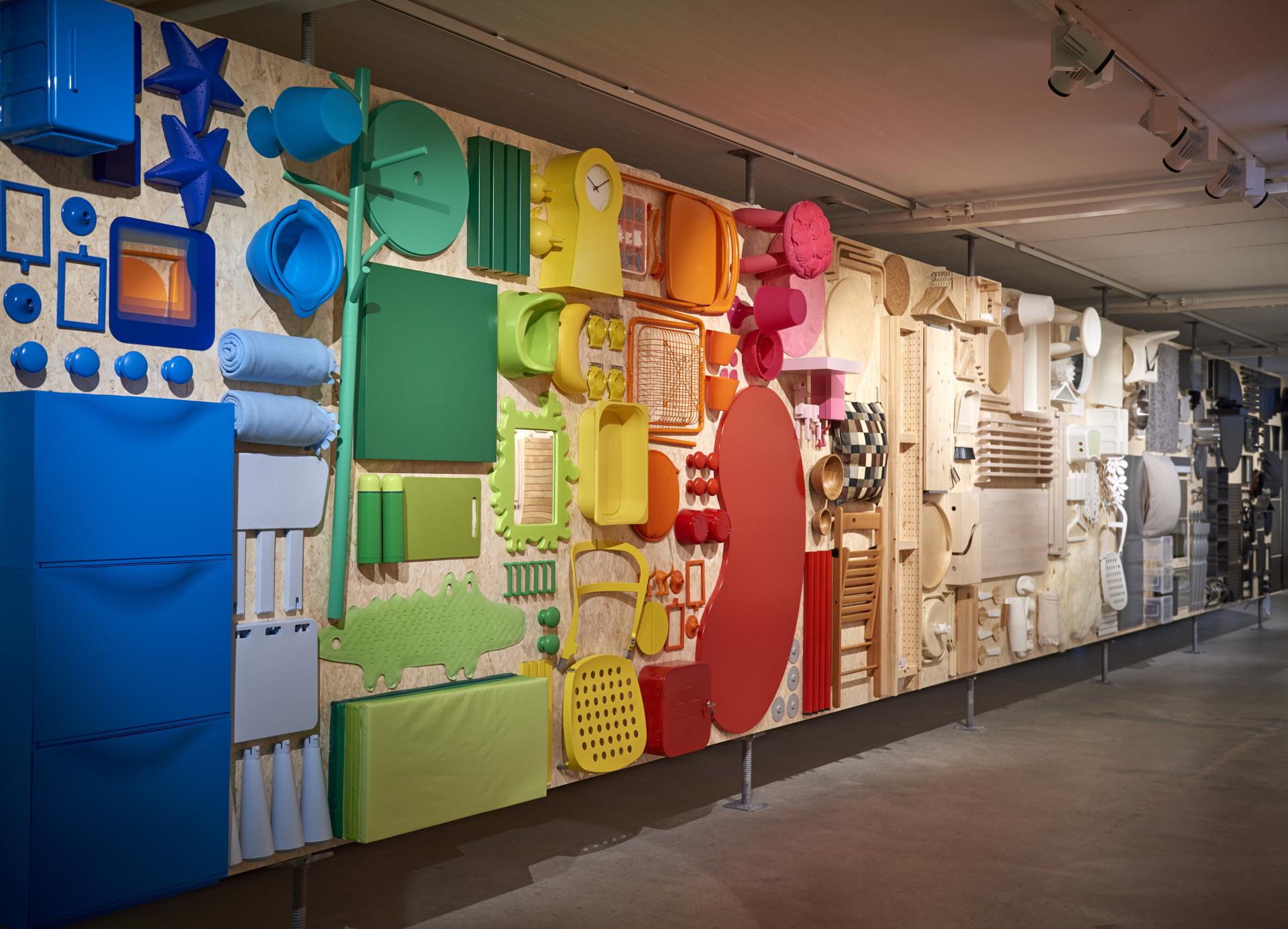 Colorful display of furniture parts and accessories at the IKEA Museum, highlighting the brand's design evolution and creativity.