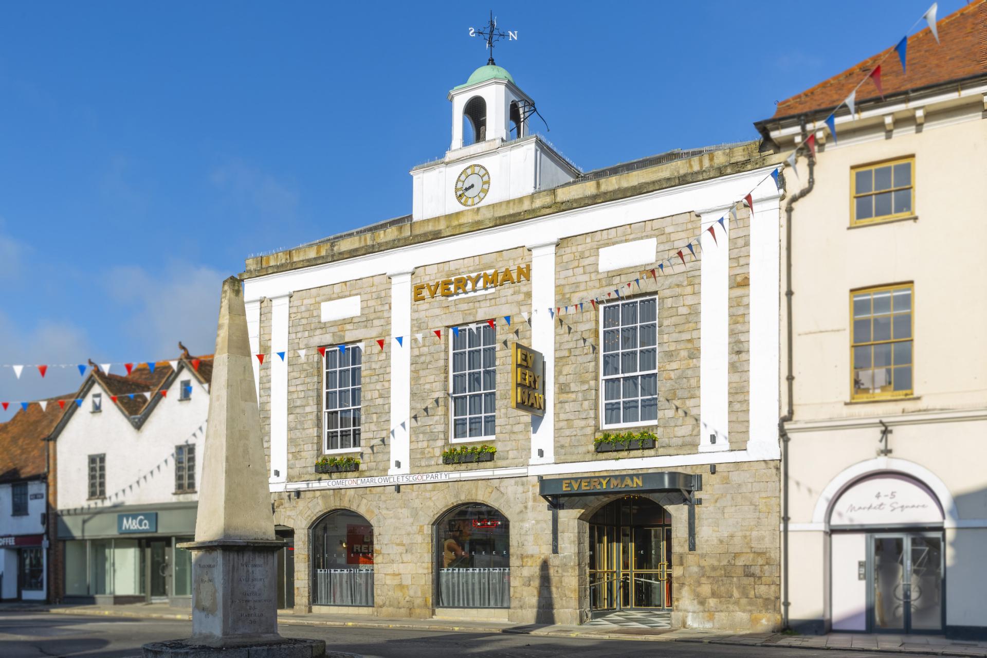 Historical Everyman cinema building adorned with bunting, showcasing its connection to community events and well-being.