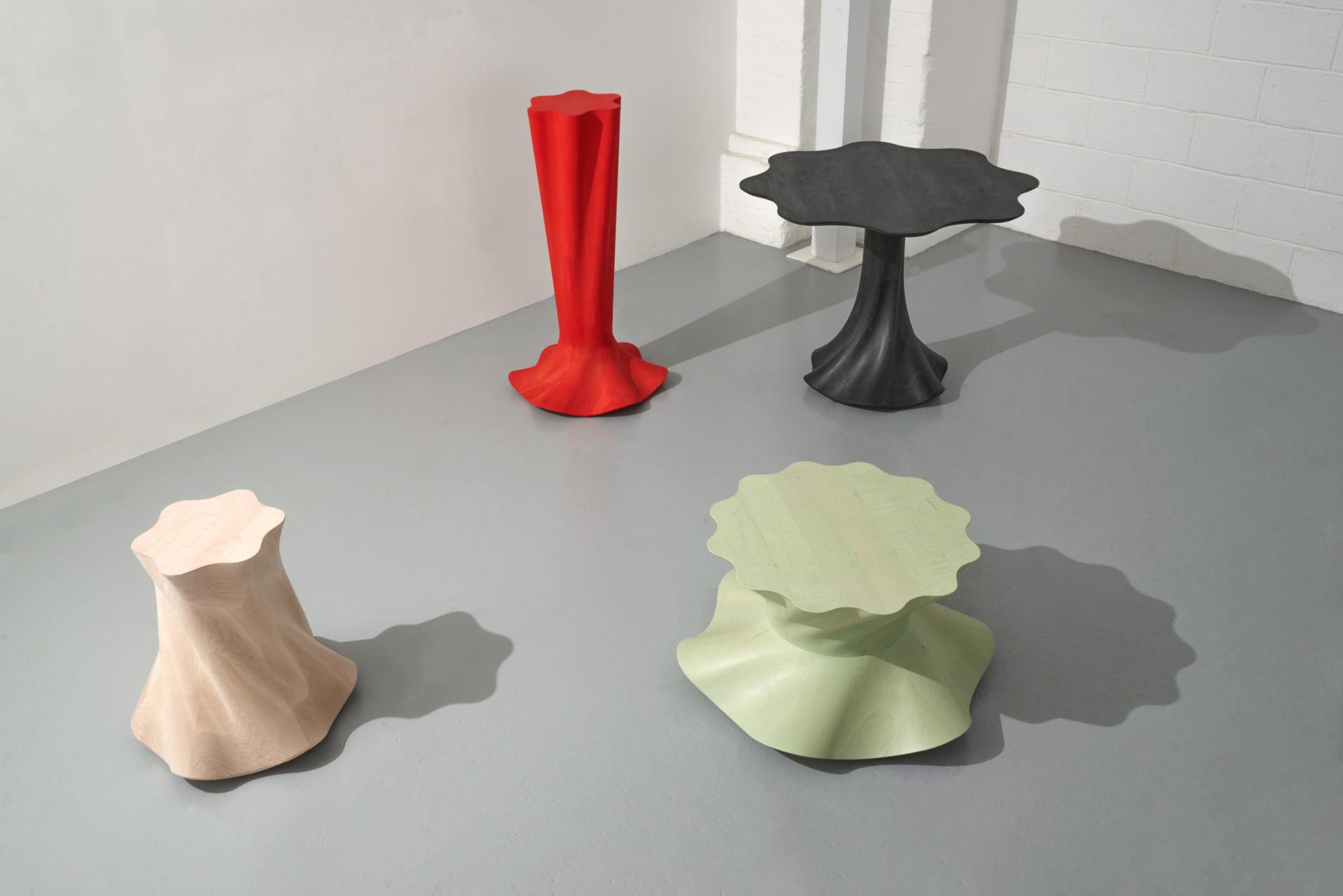 Colorful, sculptural furniture pieces by Jan Hendzel showcase innovative designs blending traditional carpentry with modern techniques.