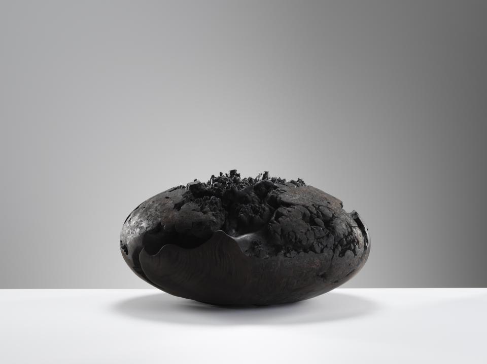 Sculptural ceramic piece showcased at Cockpit Arts Summer Festival, featuring organic forms and a textured black surface.