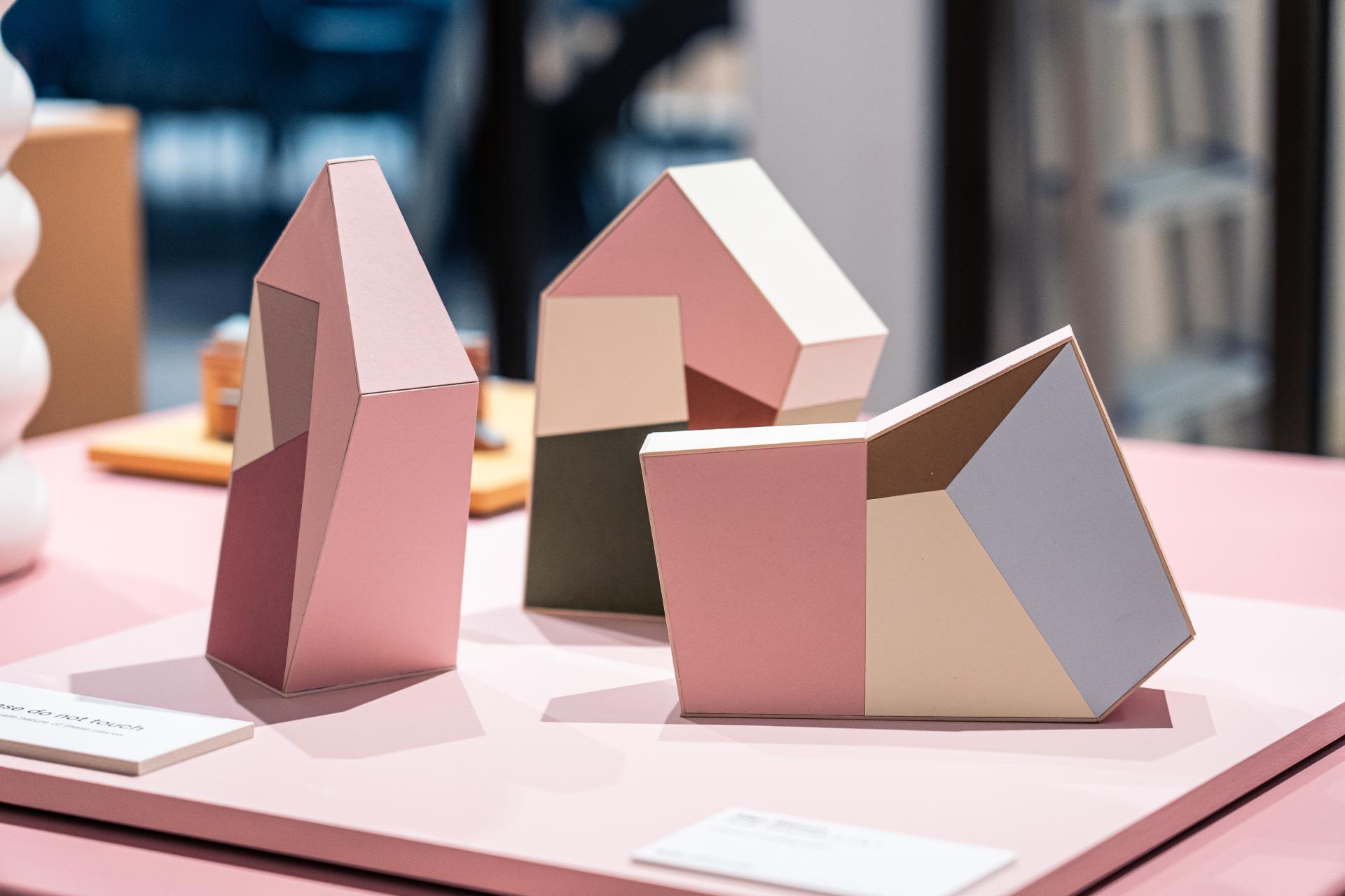 Geometric paper sculptures in pastel colors displayed at the Makers in Residence showcase at Material Source Studio, Glasgow.